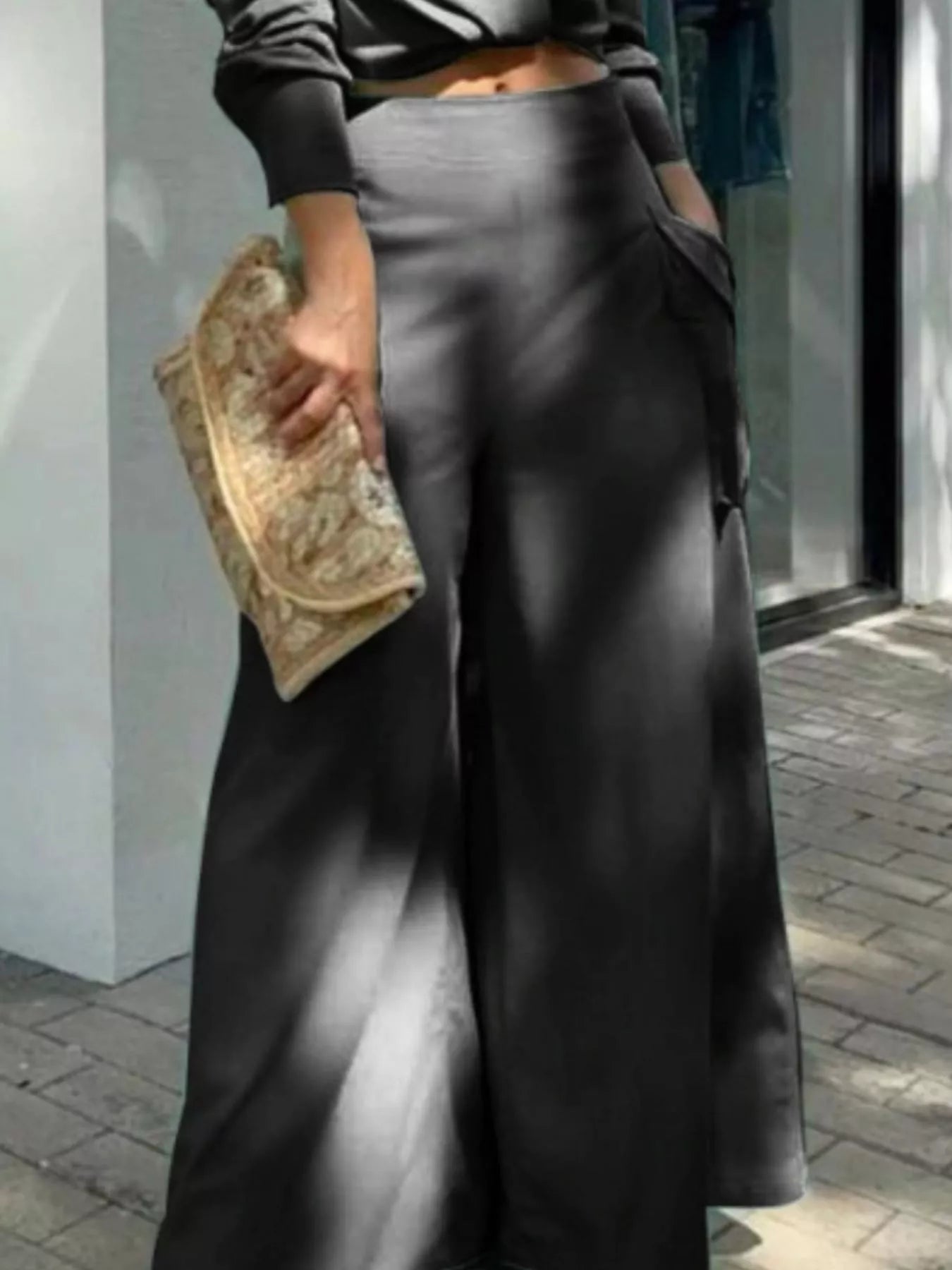 Button front shirt and pocketed wide-leg pants set by Trendsi, showing the stylish coordinated blouse and flowy pants ensemble.