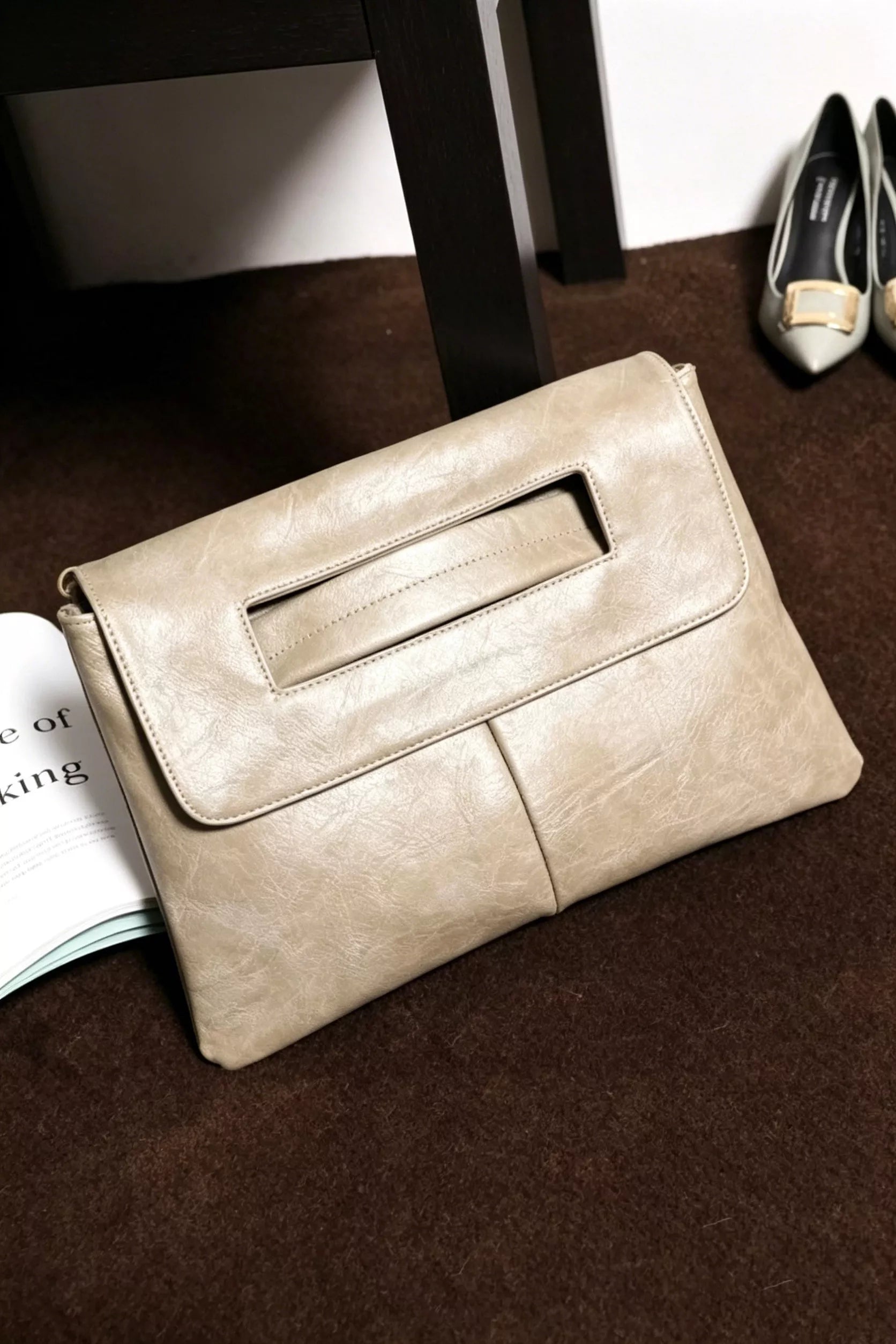 Vintage style envelope clutch handbag by Trendsi, featuring a sleek, minimalist design with a secure flap closure.