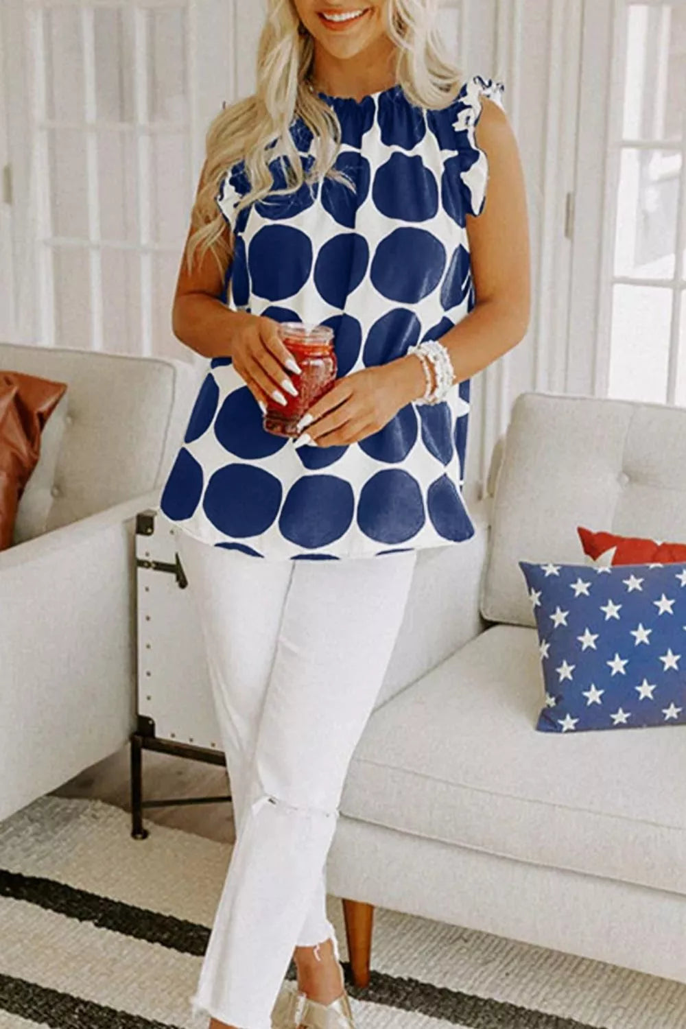 Polka dot ruffled sleeve cami top from Trendsi, featuring a stylish design with ruffled short sleeves and a flattering fit.