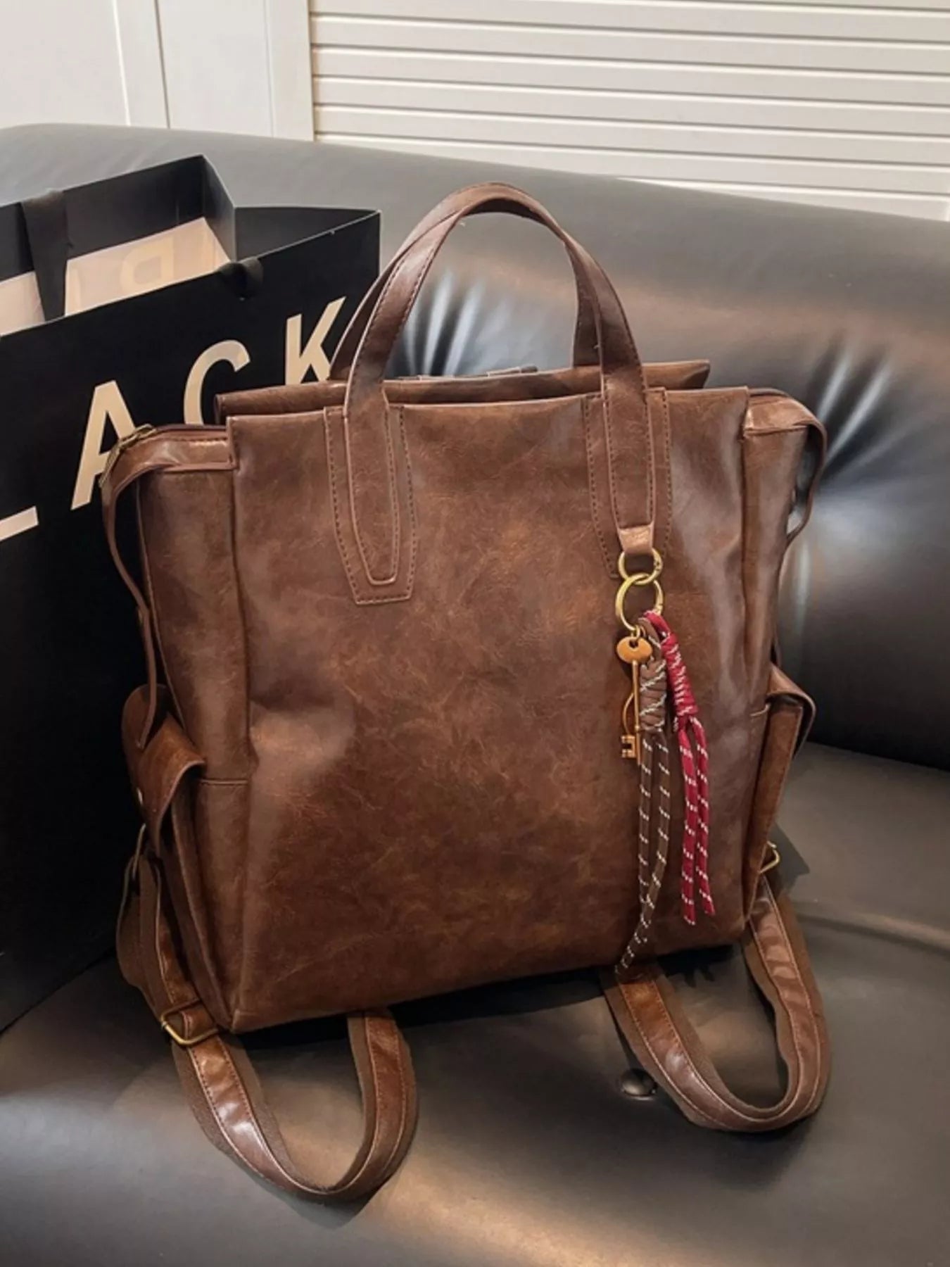 Vintage leather convertible backpack bag by Trendsi, showing the stylish design with adjustable straps and spacious interior.