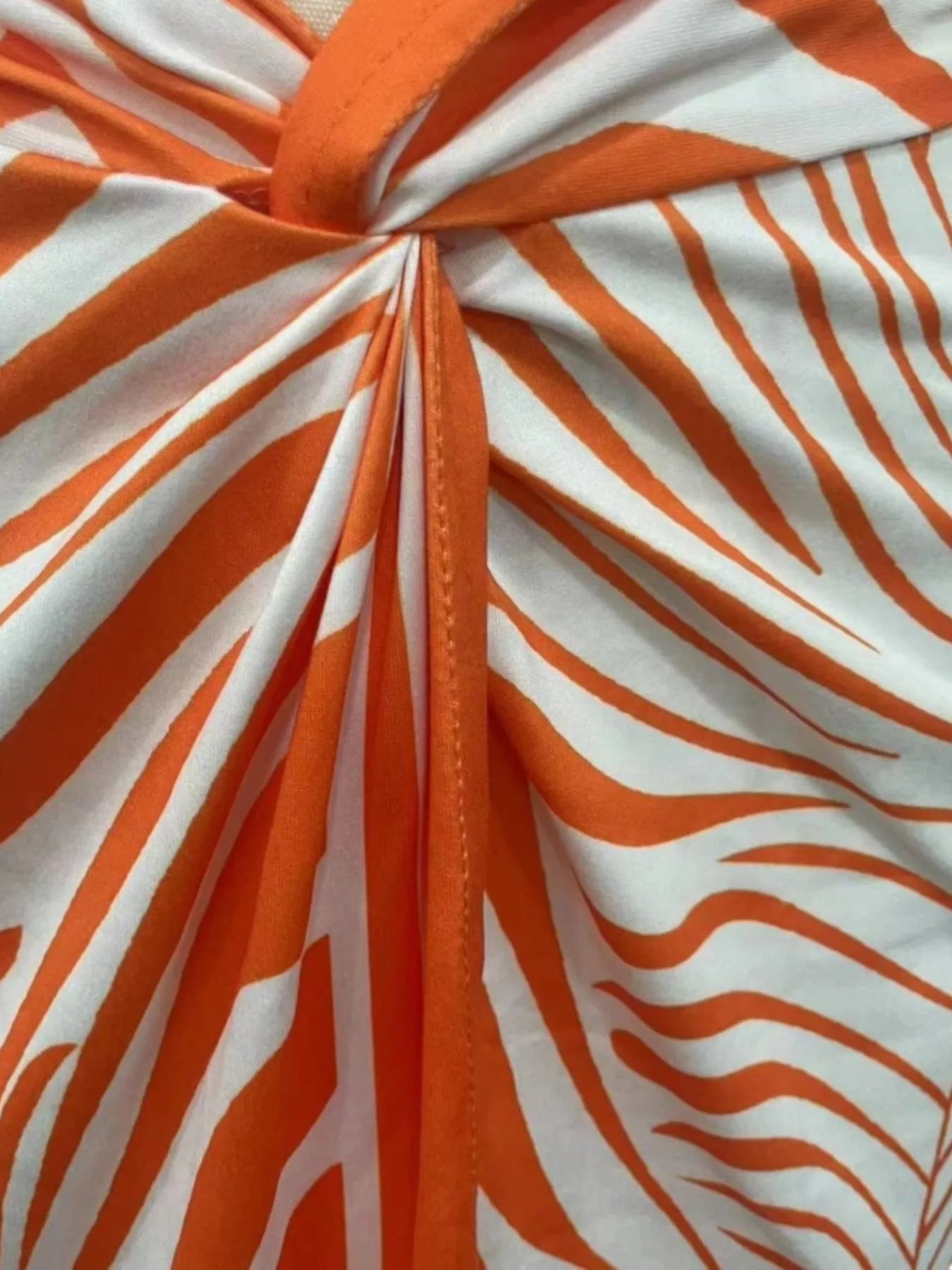 Palm print twisted slit skirt from Trendsi, stylish skirt with a slit and bold tropical palm pattern, perfect for warm weather.
