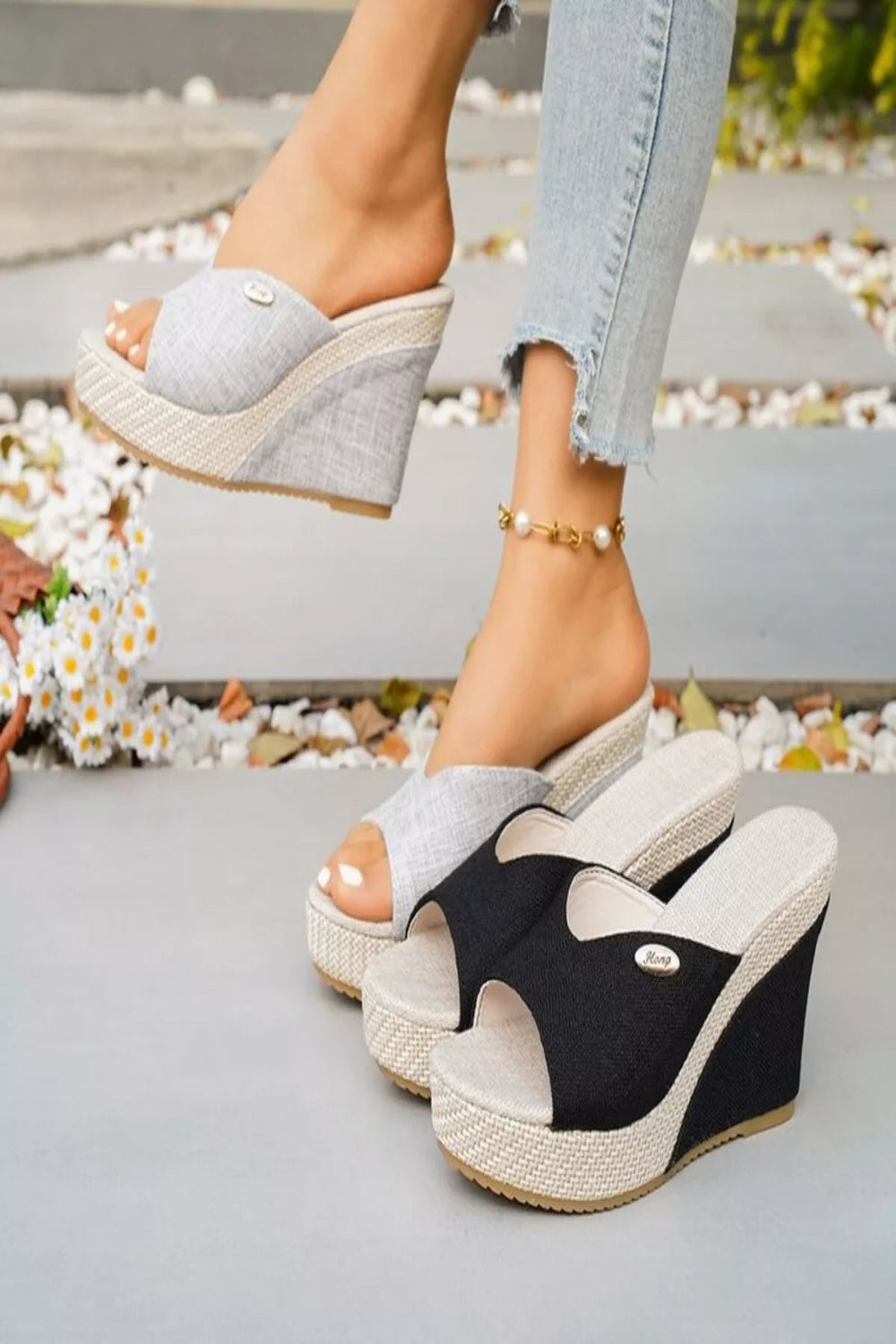Open toe wedge sandals by Trendsi featuring a stylish design with a comfortable heel and airy open toe style.