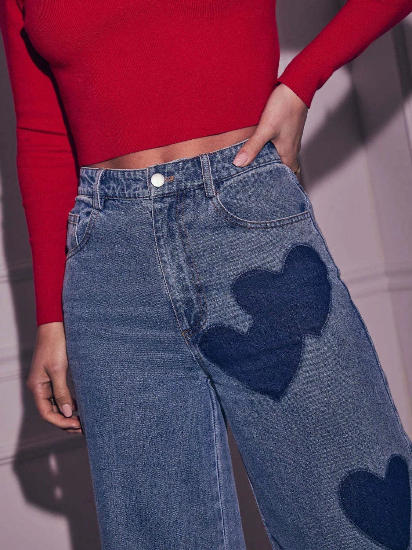 Beige heart-shaped high waist wide-leg denim jeans from Trendsi, featuring a fitted waist and flowing pant legs.