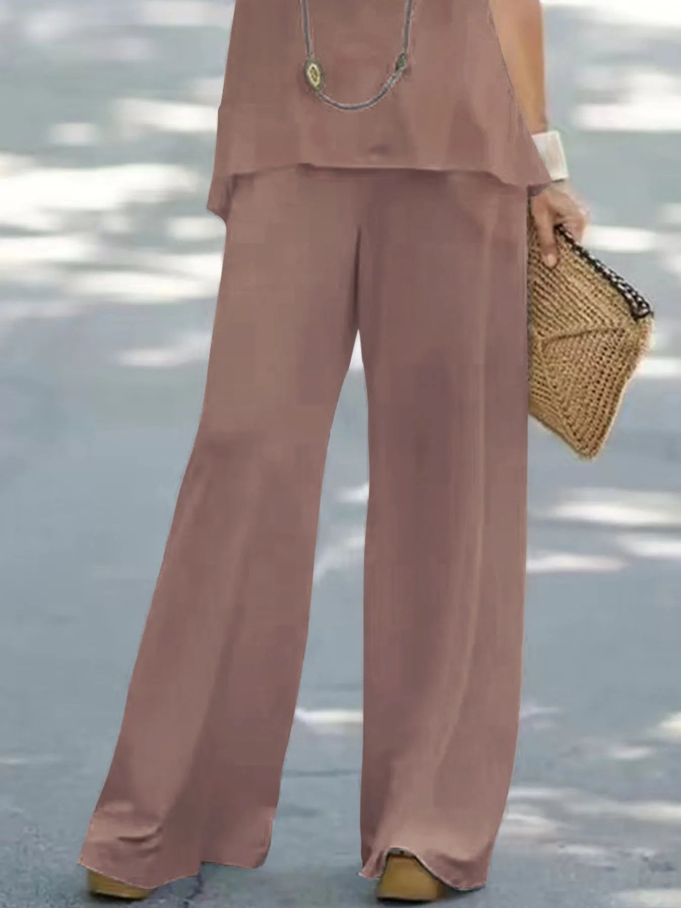 Trendsi halter top and wide-leg pants set featuring a stylish matching crop top and flowy, high-waisted pants in a modern design.