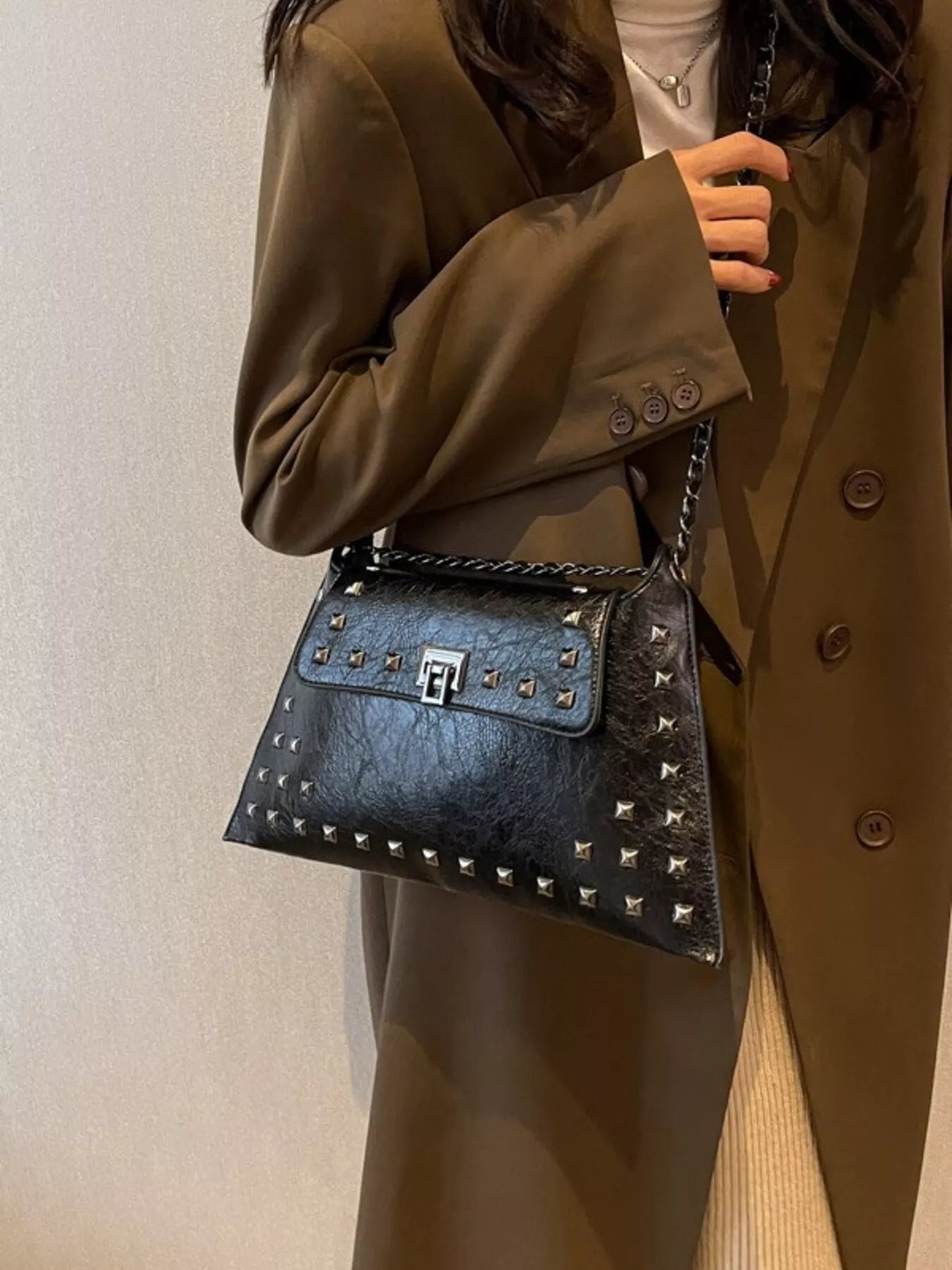 Black studded flap chain shoulder bag, trendy Trendsi handbag with silver chain strap and textured flap detail.