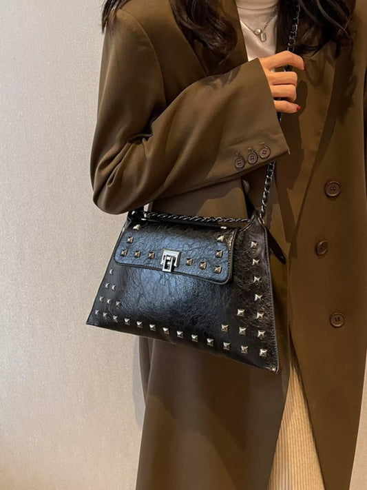 Black studded flap chain shoulder bag, trendy Trendsi handbag with silver chain strap and textured flap detail.