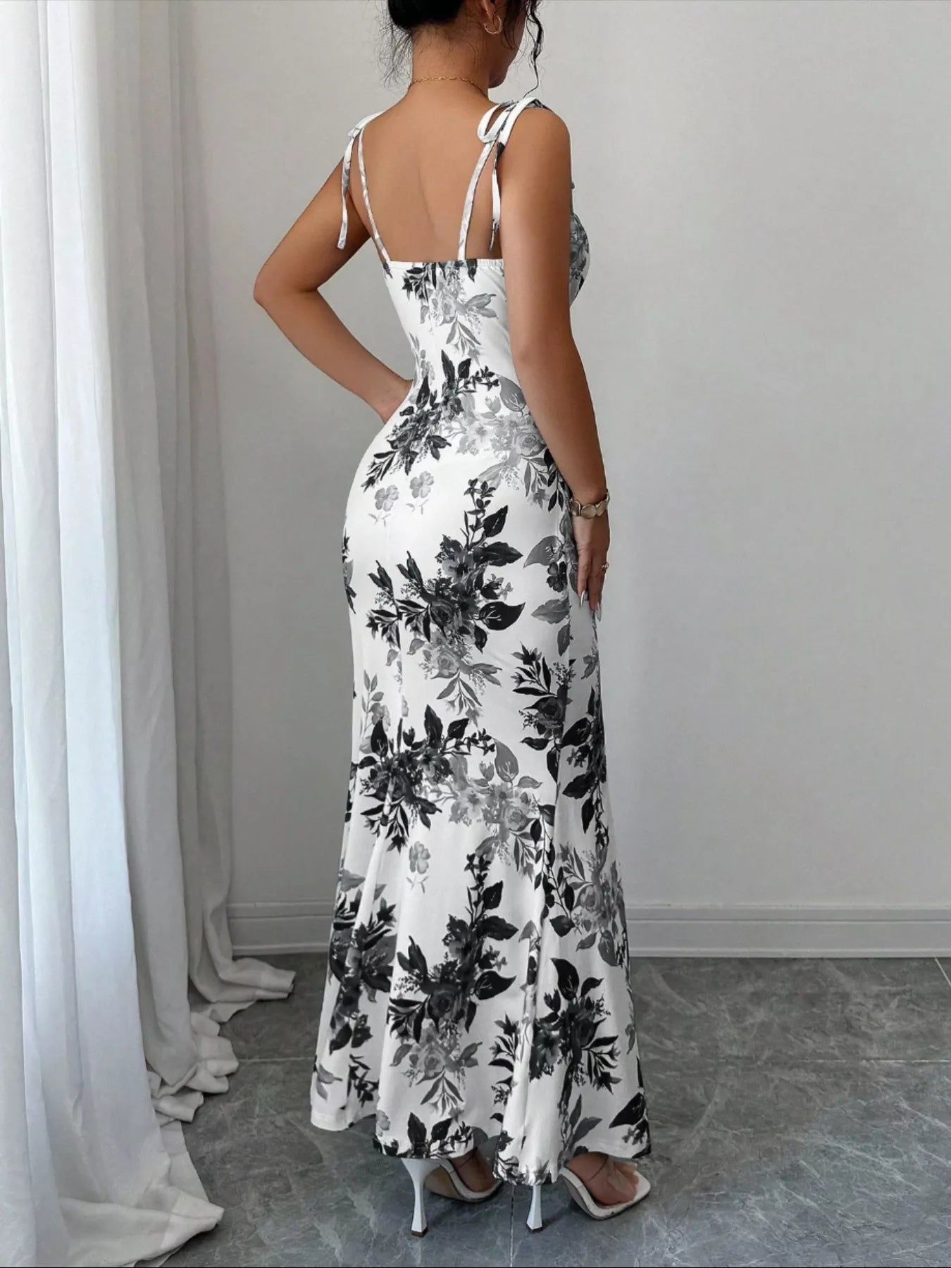 Printed tie strap slit maxi dress by Trendsi featuring a flowy silhouette, adjustable straps, and a high slit for a stylish look.