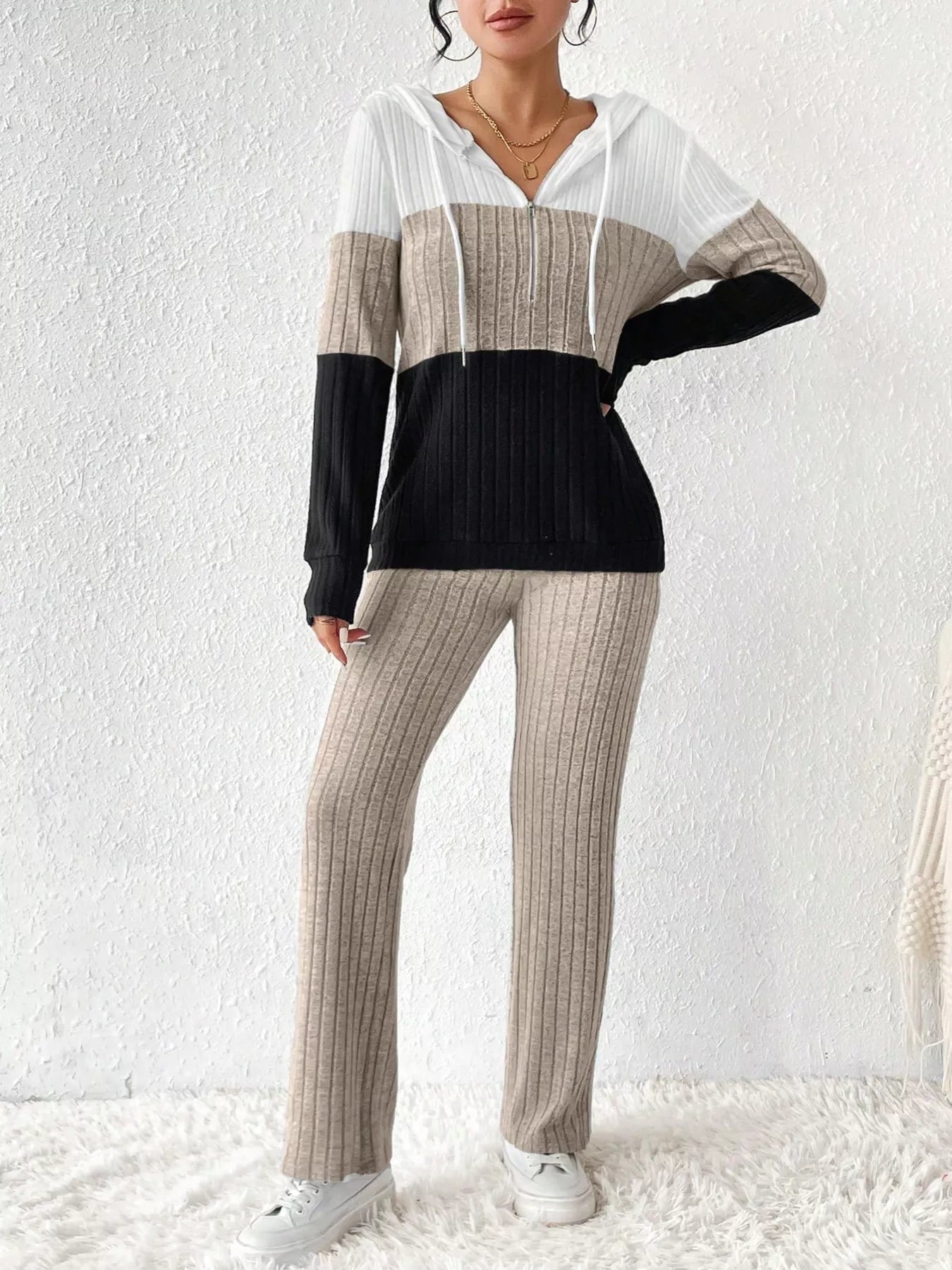 Color block half zip hooded top and matching pants set by Trendsi, featuring a stylish design and comfortable fit.