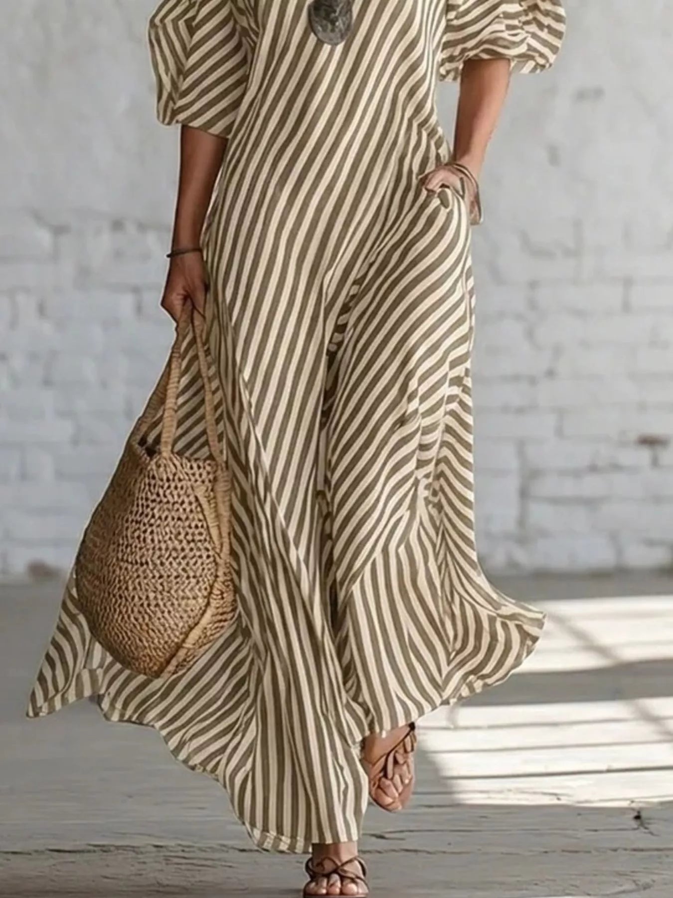 Striped one-shoulder maxi dress with bold horizontal stripes, flowing fabric, and elegant design from Trendsi.