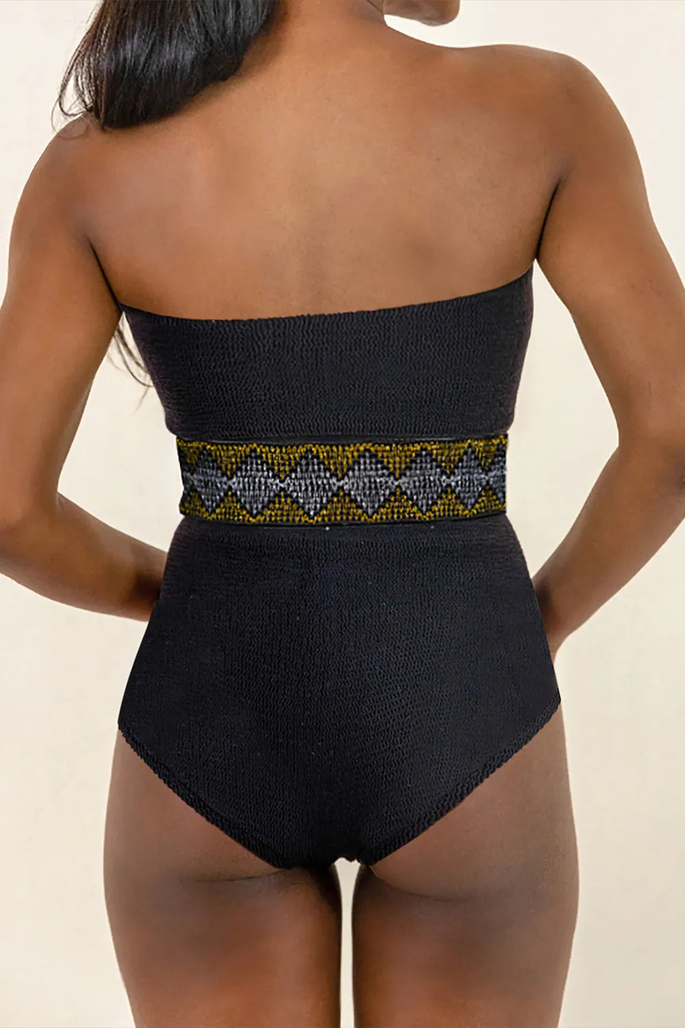 Geometric tube one-piece swimsuit by Trendsi featuring a sleek design with bold patterns and a fitted silhouette.
