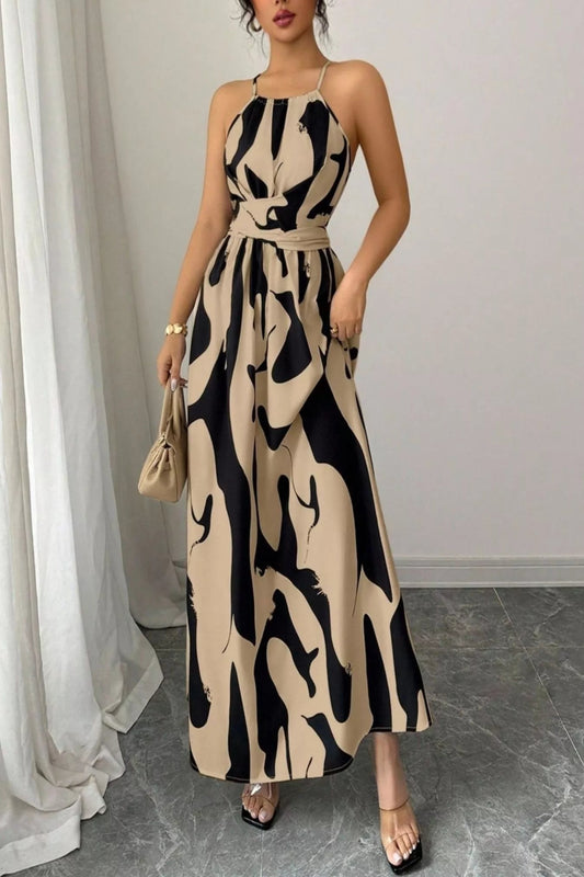 Abstract print halter neck maxi dress from Trendsi, flowing dress with bold patterns and a stylish halter neckline.