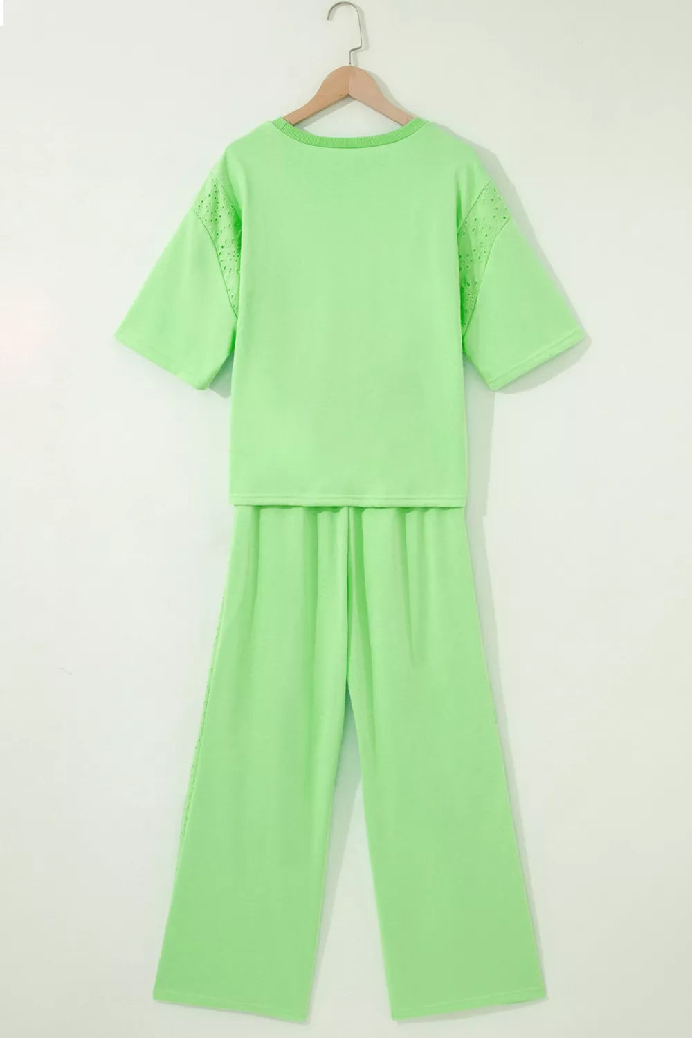 Lace patchwork half sleeve top and elastic waist pants two-piece loungewear set by Trendsi, in soft fabric with stylish design.
