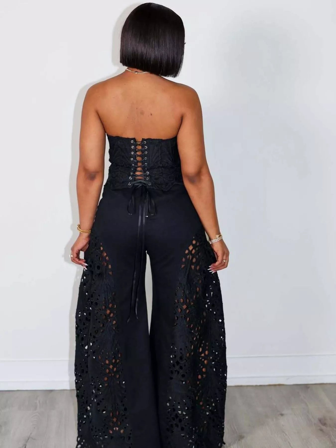 Trendsi matching set with a stylish cutout tube top and wide leg pants, featuring a trendy, modern design.