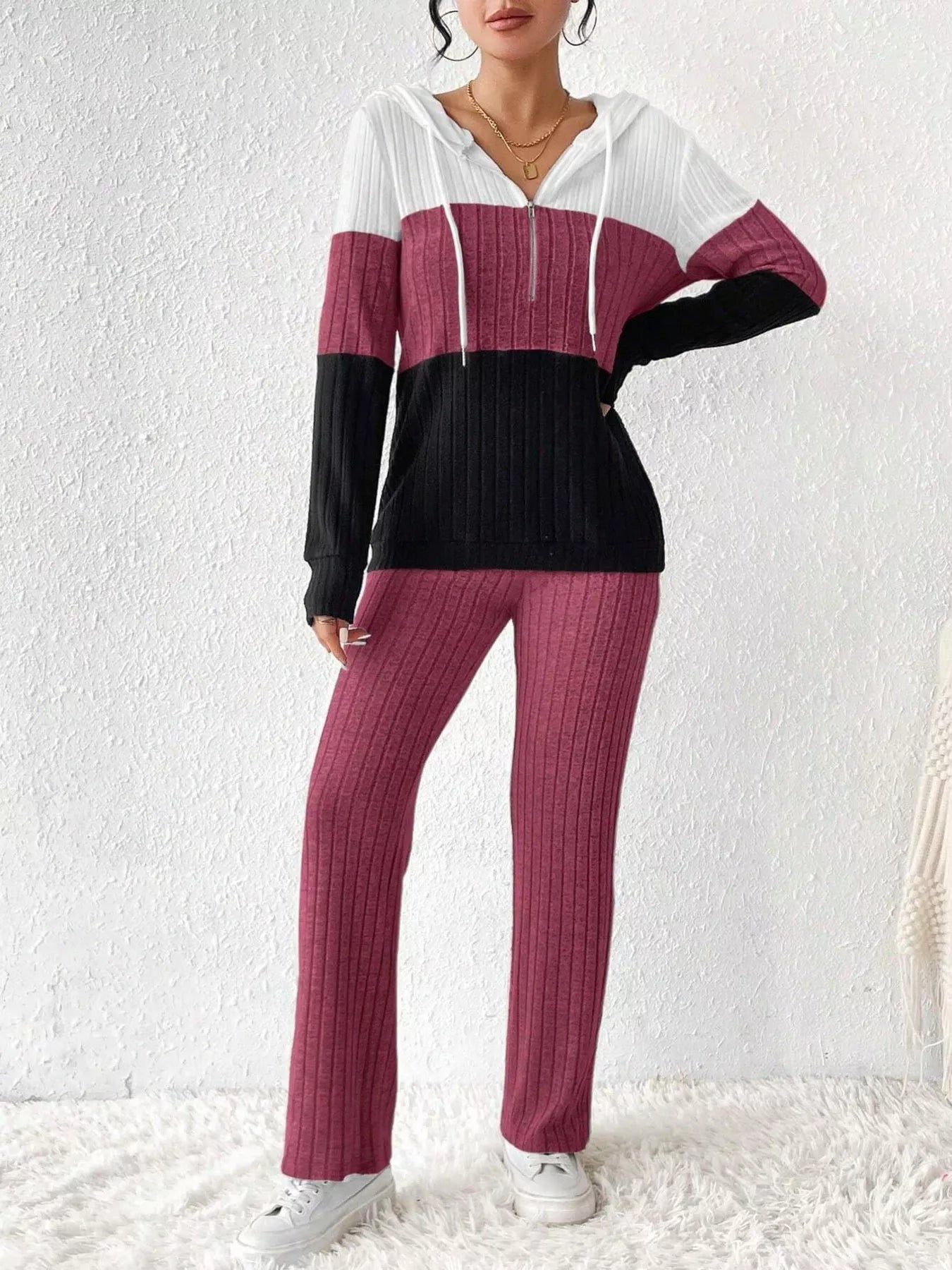 Color block half-zip hooded top and matching pants set by Trendsi, featuring vibrant color blocking and sporty design.