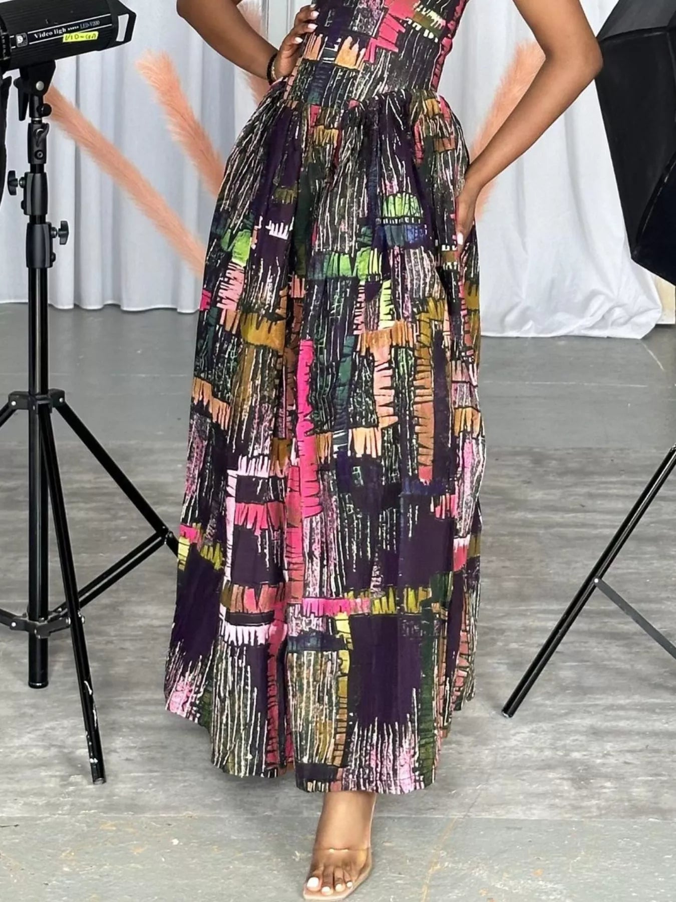 Abstract print halter neck maxi dress by Trendsi featuring a flowing silhouette and vibrant pattern, perfect for summer or special occasions.