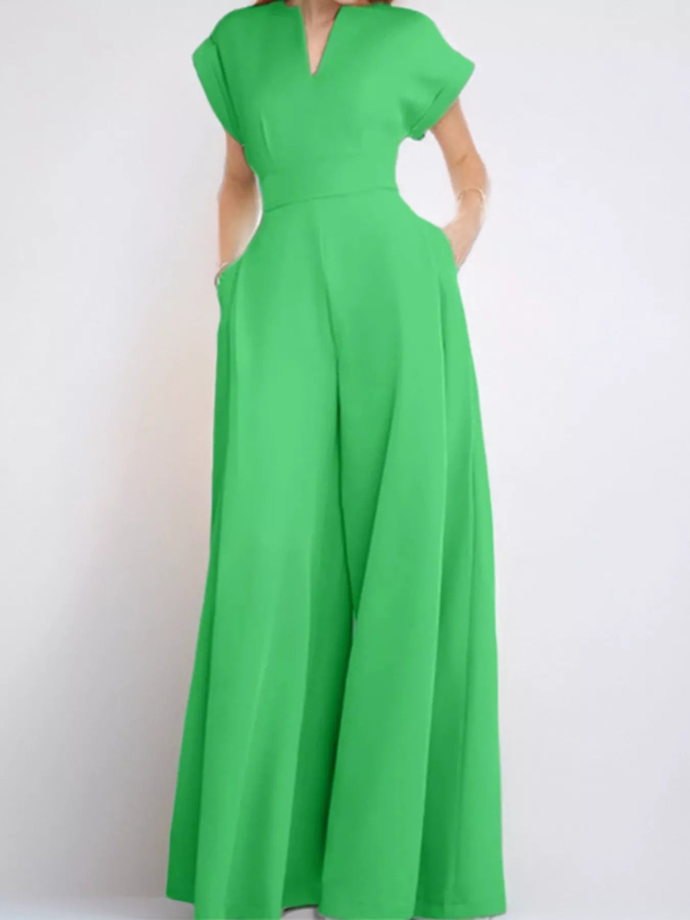 Notched wide-leg jumpsuit from Trendsi showing a stylish, modern design with a relaxed fit and wide leg silhouette.
