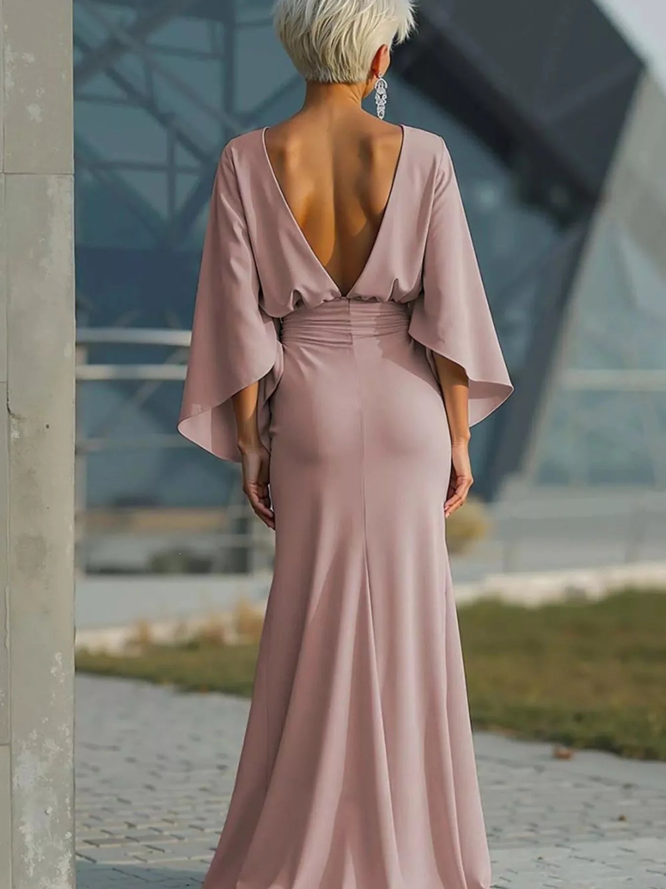 Batwing sleeve ruched evening dress by Trendsi featuring a fitted silhouette and elegant design, ideal for formal occasions.