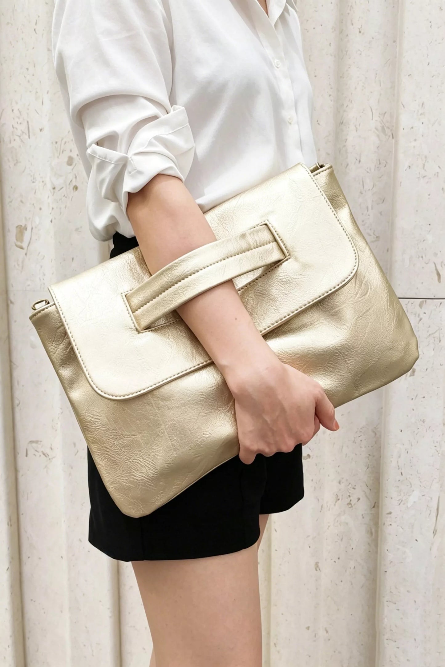 Vintage style envelope clutch handbag by Trendsi, featuring a sleek design with a fold-over flap and metal clasp.