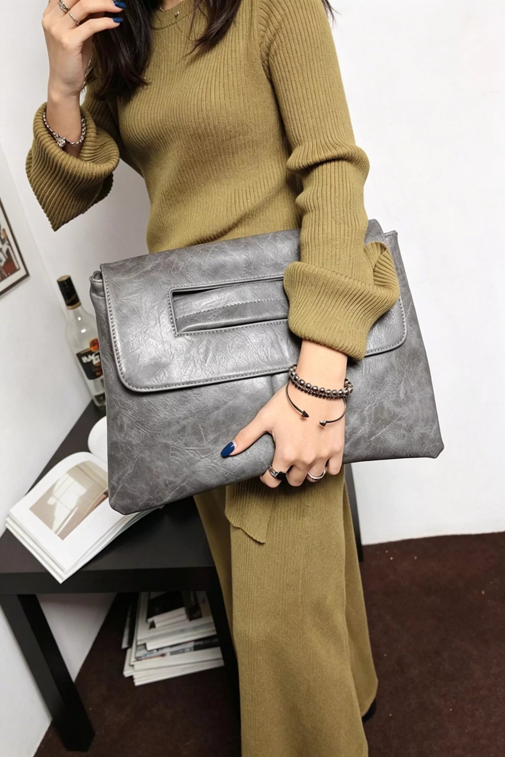 Vintage style envelope clutch handbag by Trendsi, featuring a classic design with a sleek fold-over flap and elegant detailing.