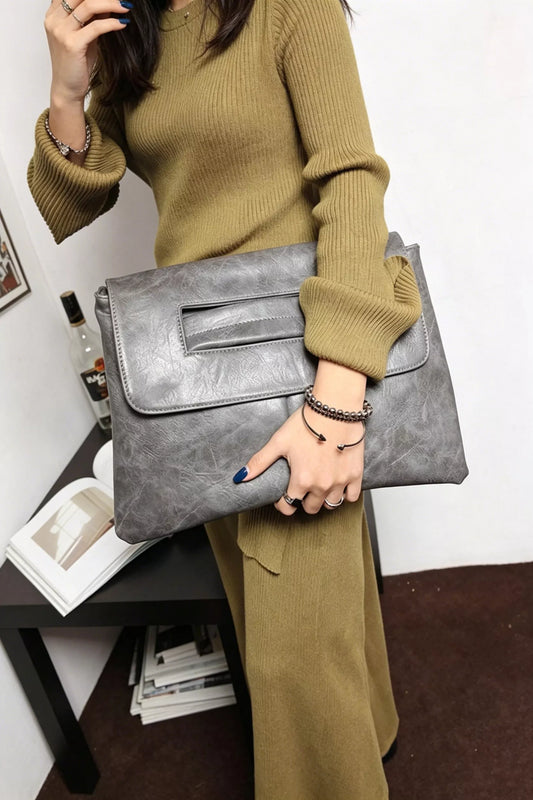 Vintage style envelope clutch handbag by Trendsi, featuring a classic design with a sleek fold-over flap and elegant detailing.