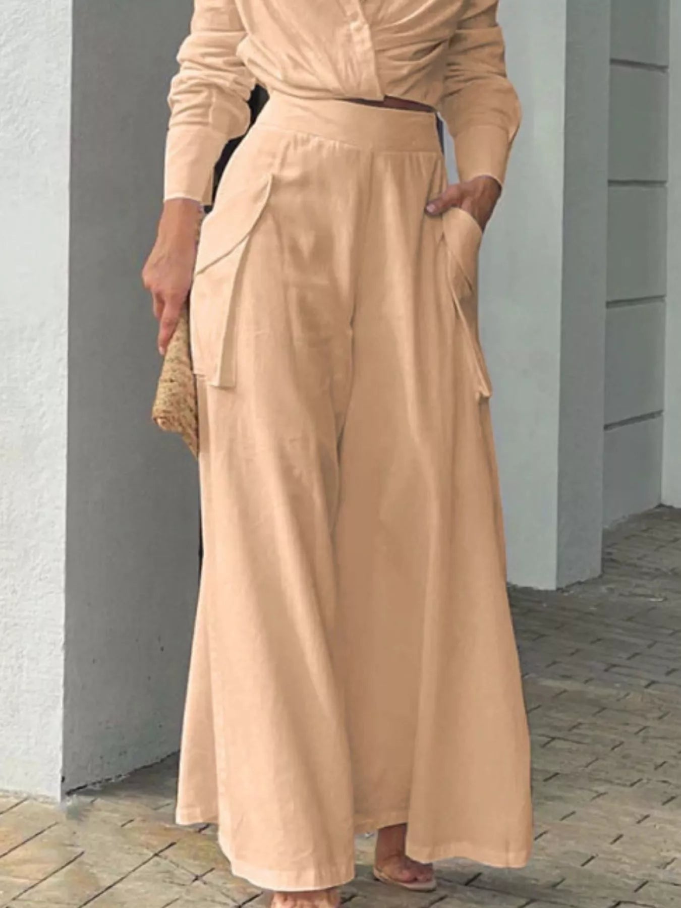 Button front shirt and pocketed wide-leg pants set by Trendsi, featuring a stylish, coordinated look with button details and comfortable fit.