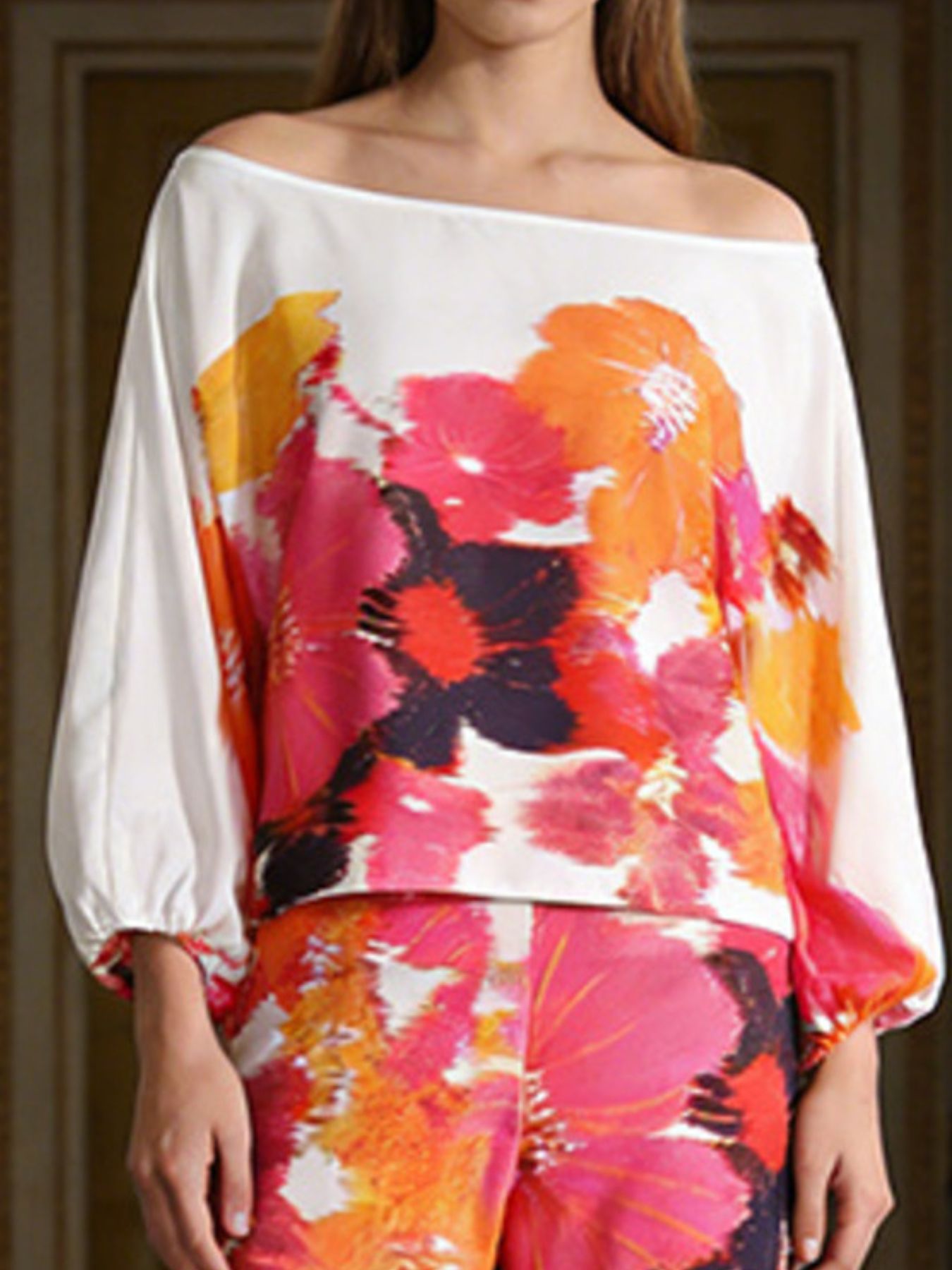 Floral print off-shoulder top and matching pants set by Trendsi, featuring a vibrant, breezy design perfect for summer wear.