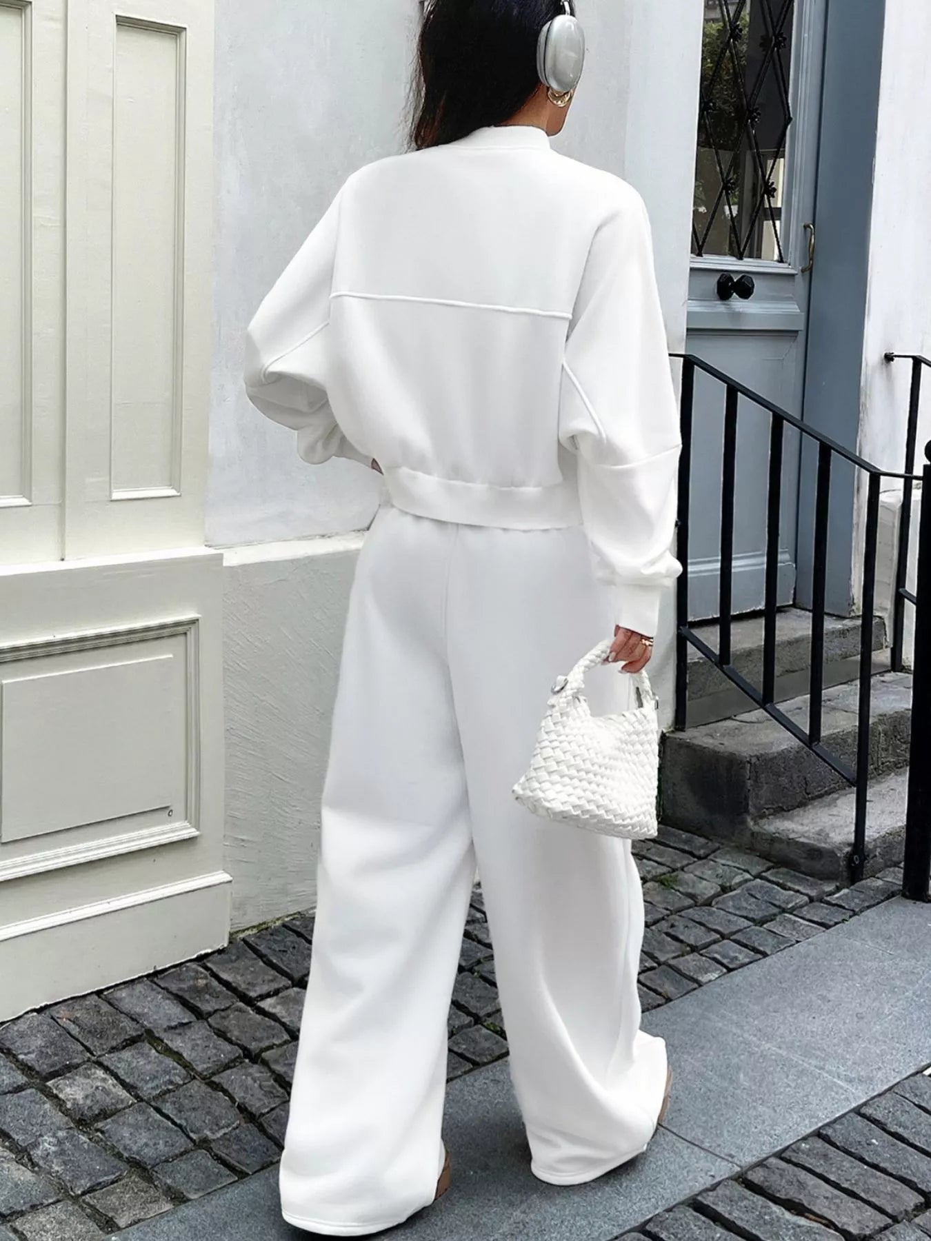White zip-up jacket and pants set by Trendsi, featuring a casual sportswear look with a comfortable fit and modern style.