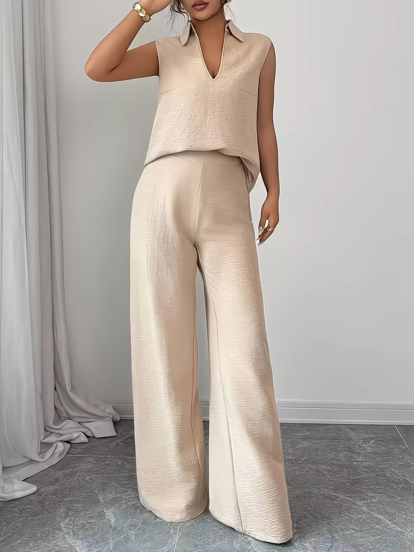 V-neck sleeveless top and wide-leg pants set by Trendsi, displayed on a model showcasing stylish casual wear.