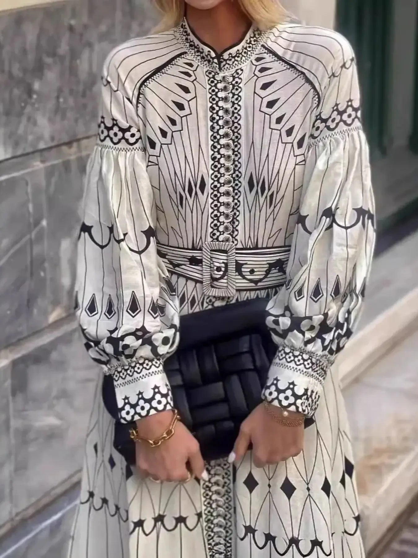 Printed shirt dress with a belt from Trendsi, featuring a relaxed fit and stylish design, displayed on a hanger.