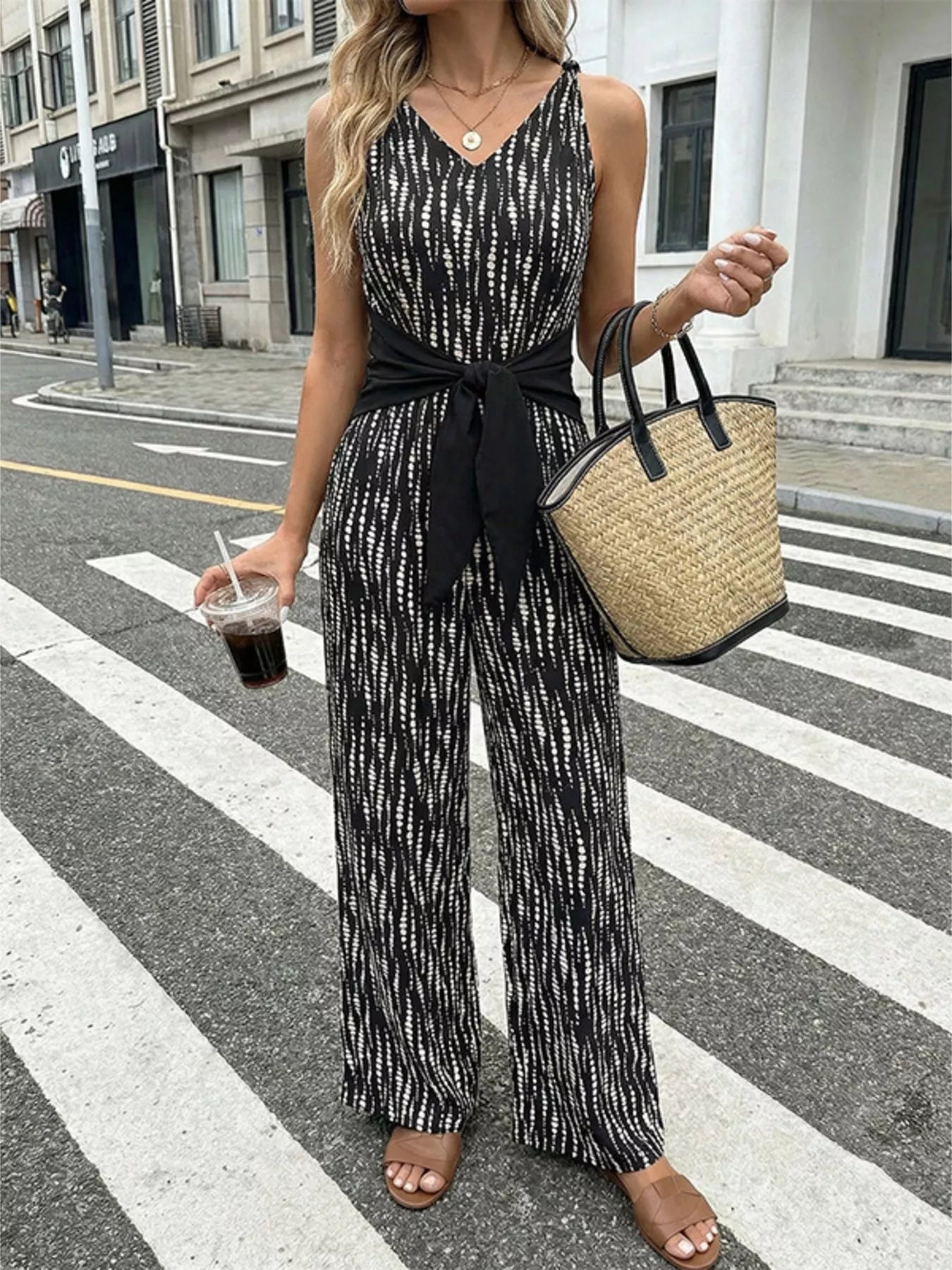 Printed wide leg jumpsuit from Trendsi, featuring a stylish design, flowing fabric, and wide-leg silhouette for a chic look.