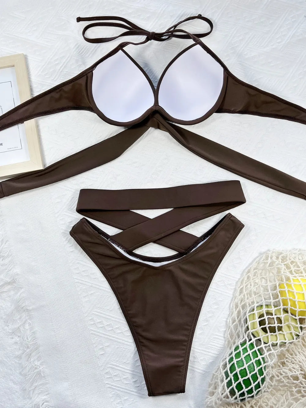 Trendsi crisscross halter neck bikini set swimwear with stylish strappy design, perfect for beach or poolside lounging.