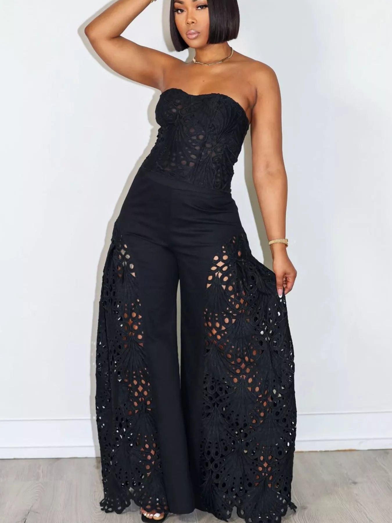 Trendsi matching set with cutout tube top and wide-leg pants, featuring a stylish, modern design in neutral fabric.