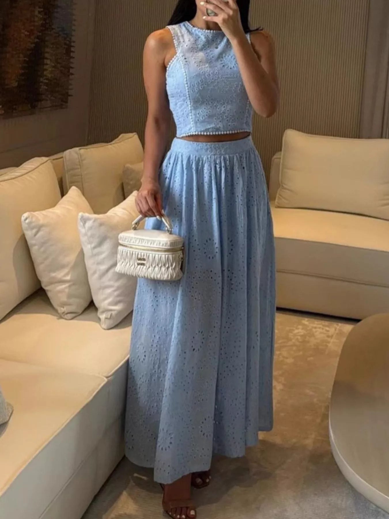 Trendsi eyelet crop top and maxi skirt set featuring a stylish coordinated outfit with eyelet detailing and a flowy silhouette.