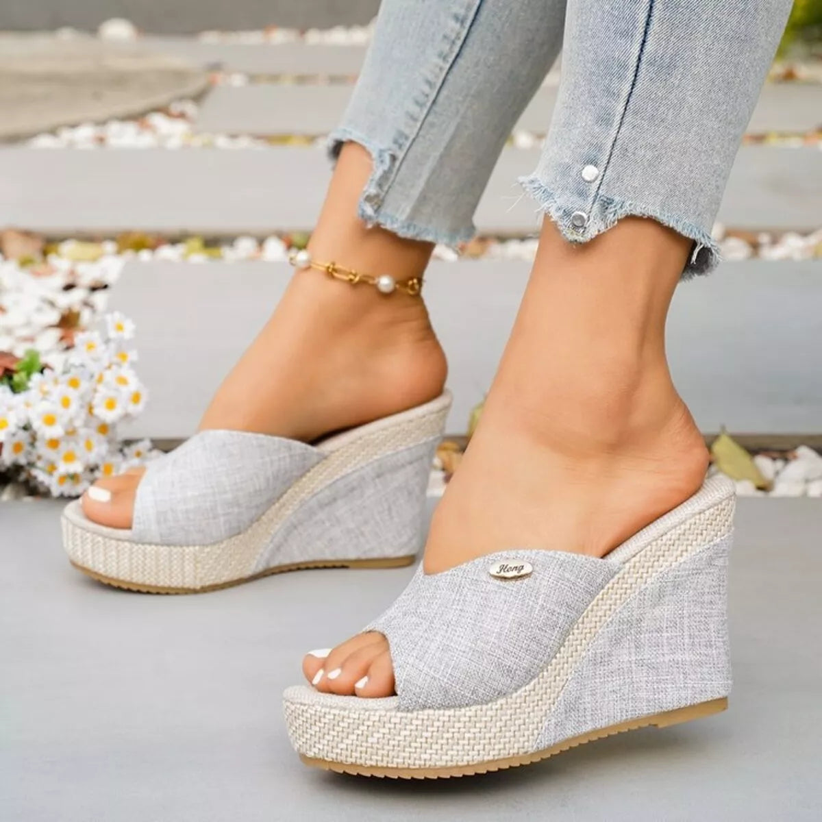 Open toe wedge sandals by Trendsi featuring a stylish design with a comfortable wedge heel and open toe style.
