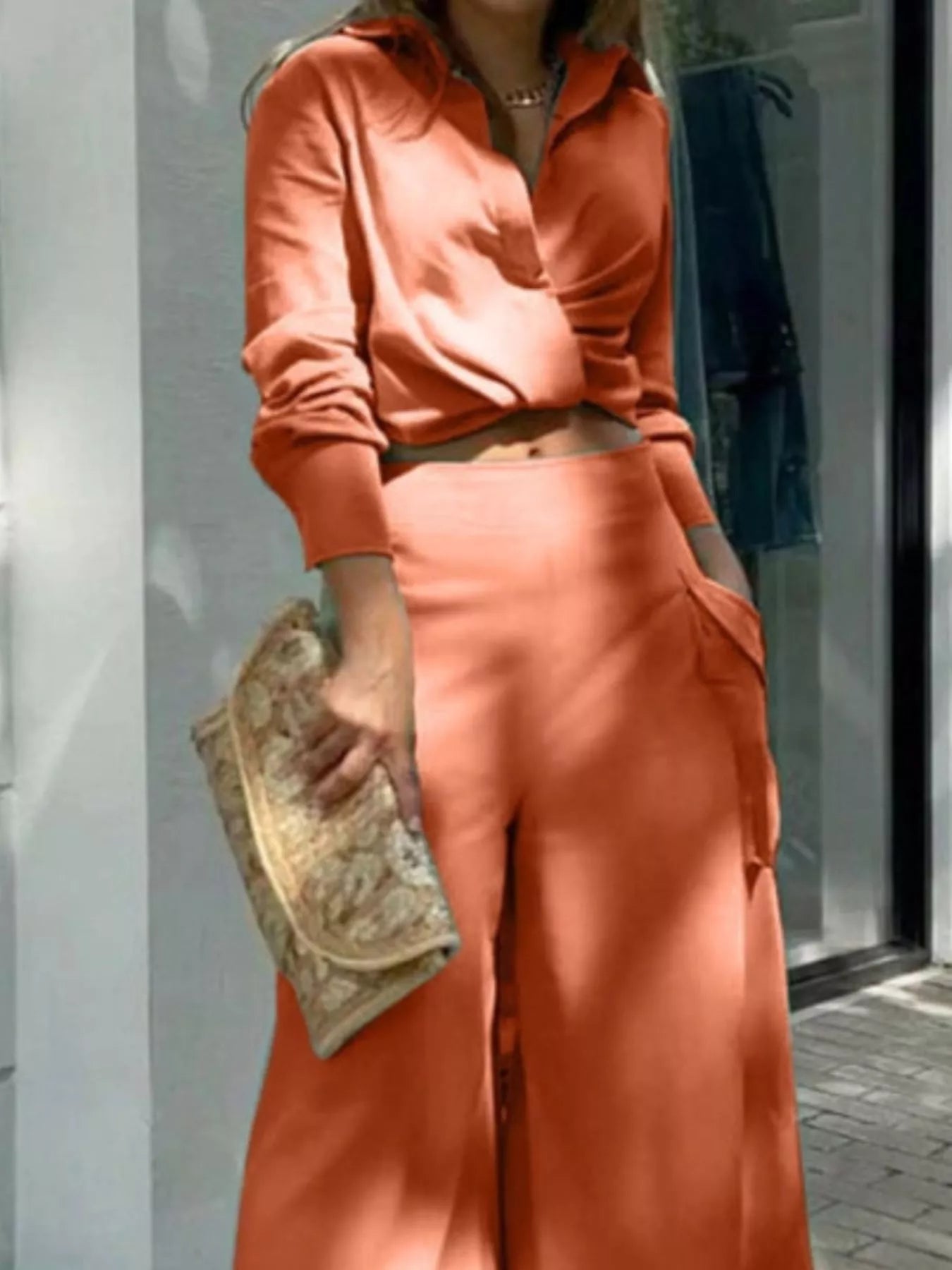 Button front shirt and pocketed wide leg pants set by Trendsi, featuring a stylish button-up top and relaxed wide-leg trousers.