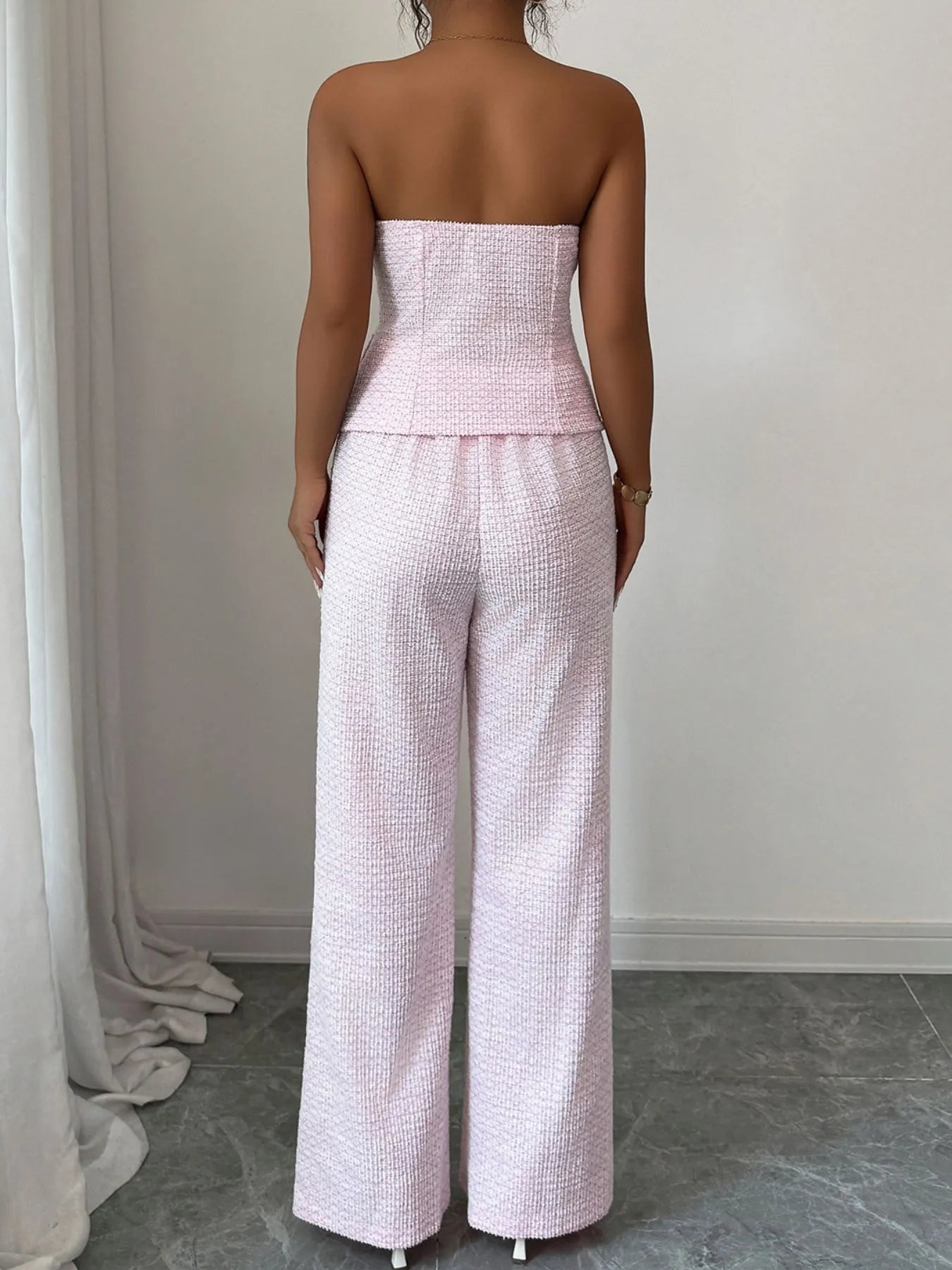 Blush pink sweetheart neck tube top and matching pants set from Trendsi, stylish and comfortable, shown on a model.