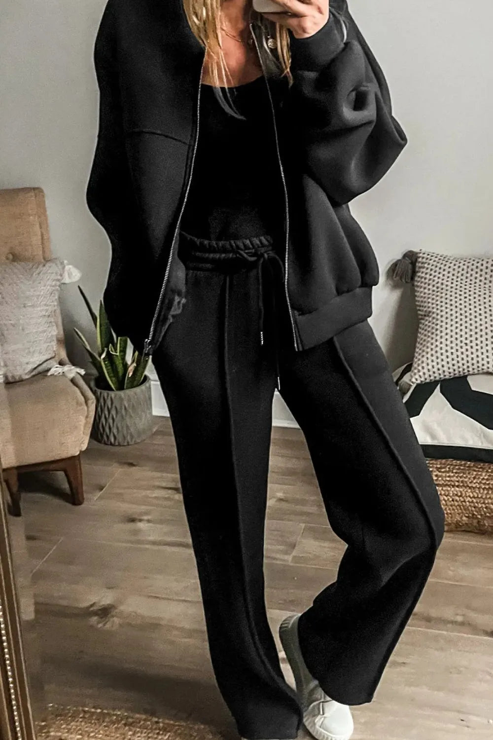 Trendsi zip-up long sleeve top and matching pants set, stylish and comfortable loungewear in soft fabric, displayed on a hanger.