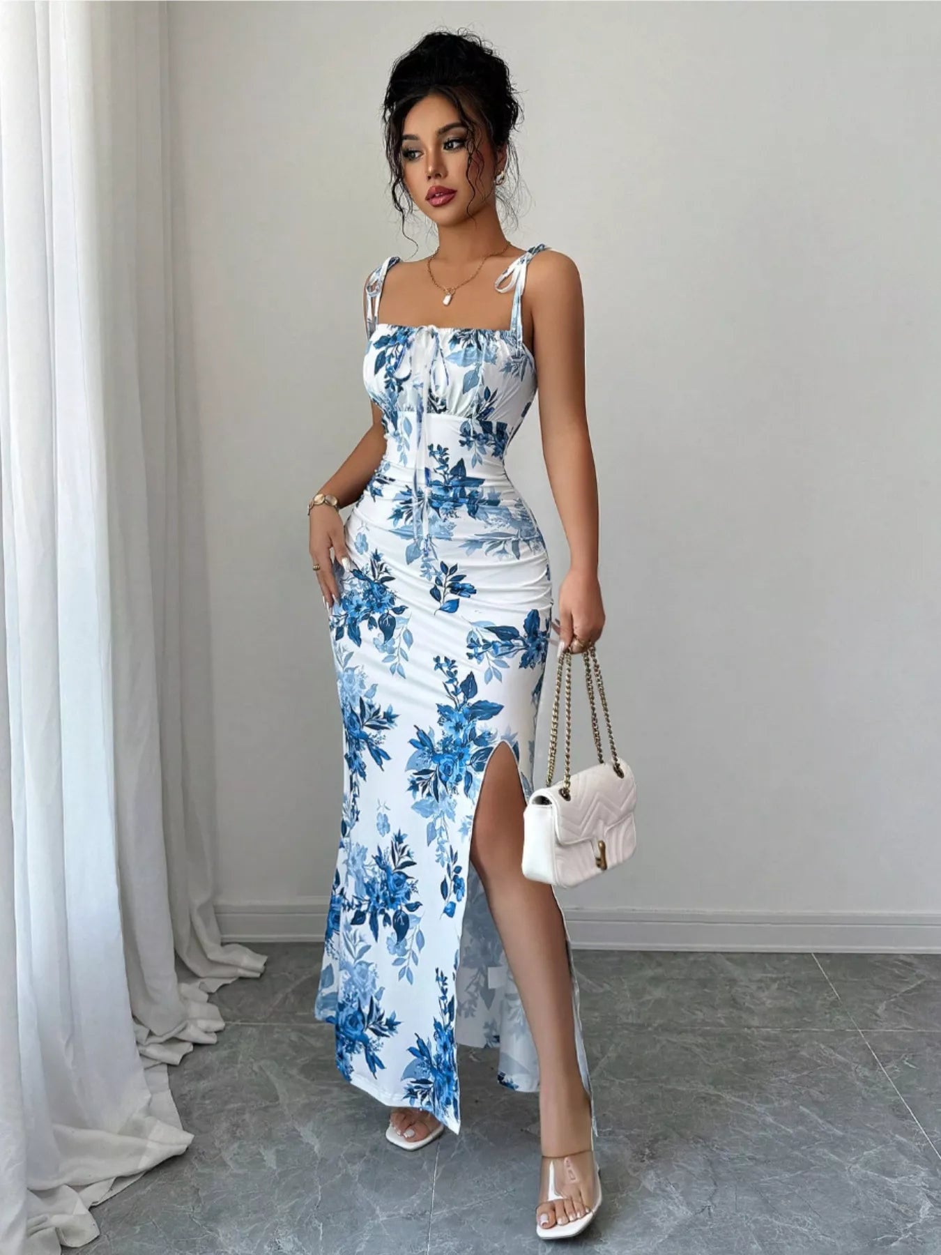 Printed tie-strap slit maxi dress from Trendsi featuring a flowy silhouette, vibrant print, and adjustable straps.
