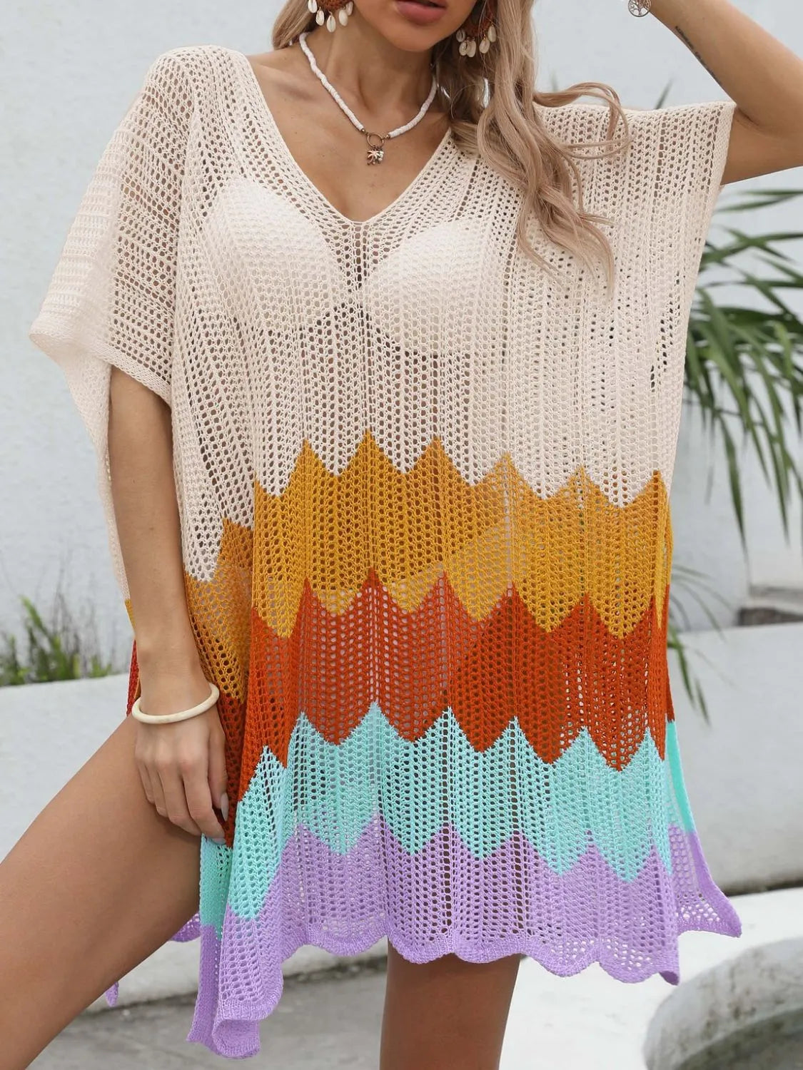 Openwork V-neck half sleeve swim cover-up by Trendsi, featuring lightweight, airy fabric with intricate openwork design.
