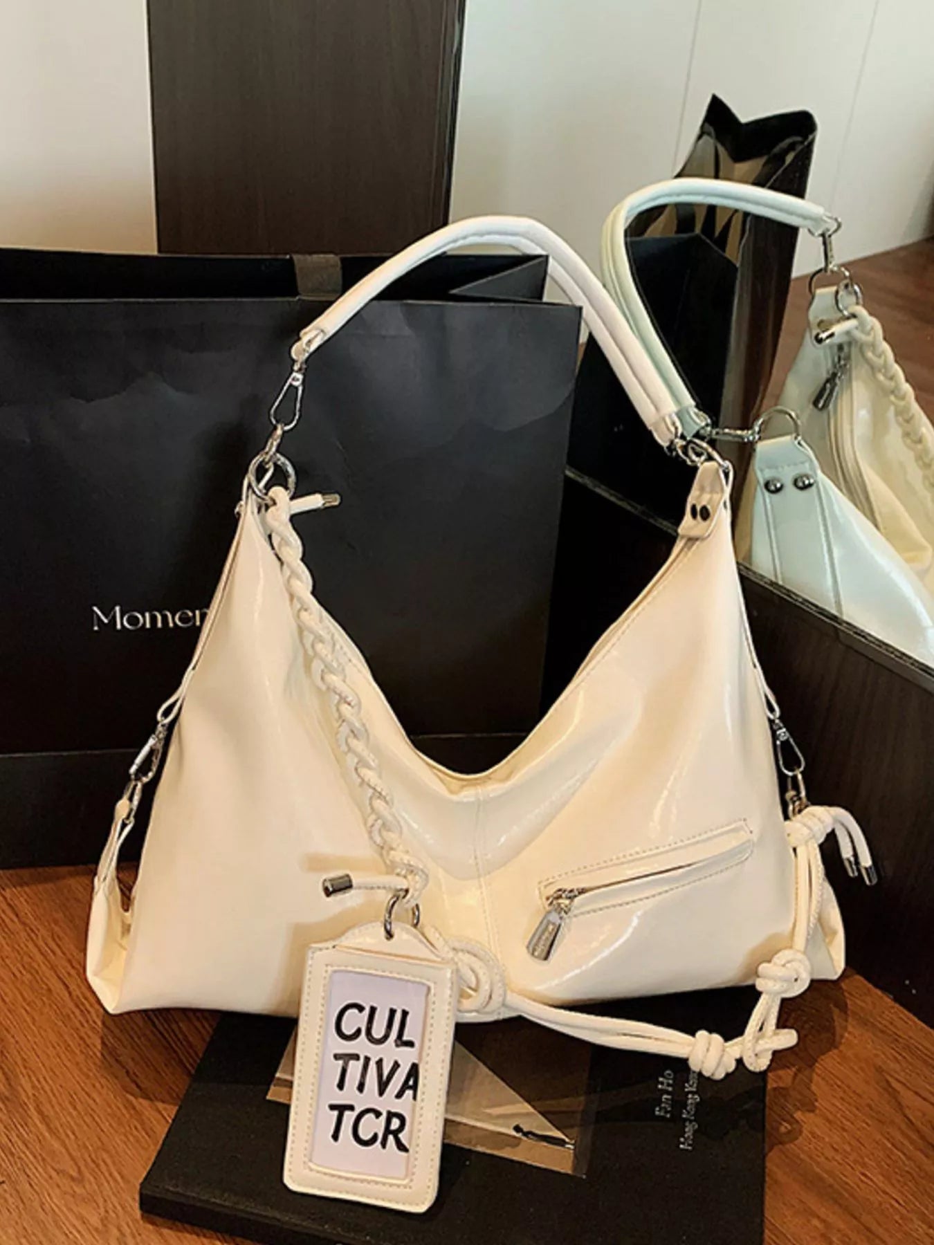 Vintage braided strap shoulder handbag by Trendsi, featuring a stylish woven design and classic shoulder bag shape.