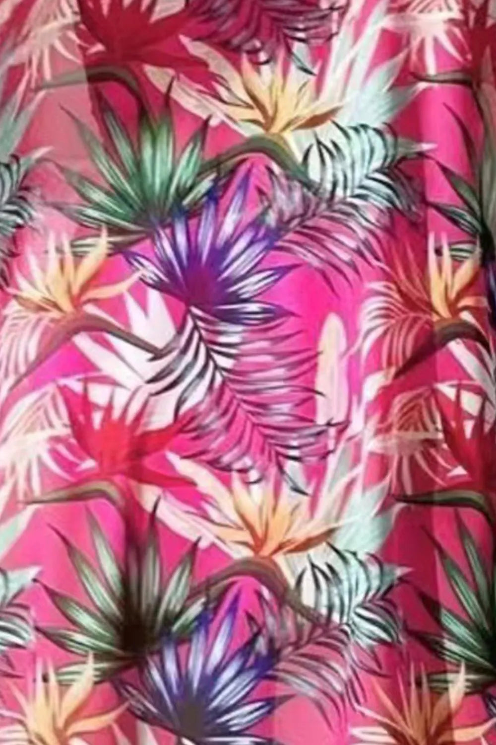 Printed halter neck three-piece swim set featuring a bikini top, matching bottoms, and a cover-up in vibrant patterns.