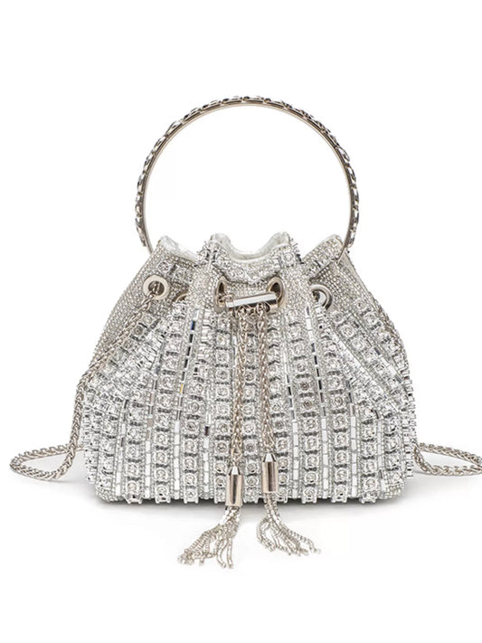 Rhinestone embellished bucket crossbody bag from Trendsi featuring sparkling rhinestones and a stylish handbag design.