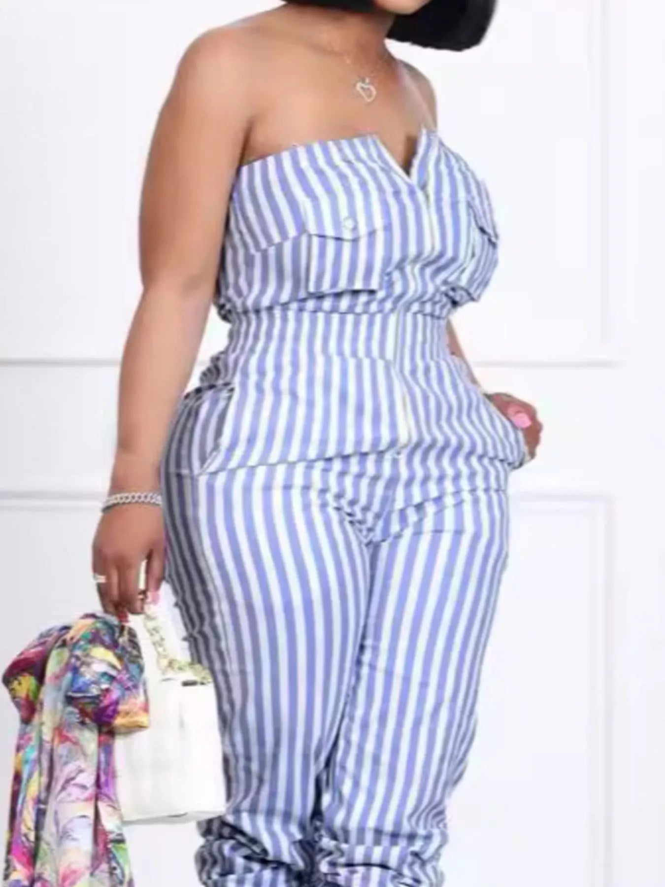 Striped tube jumpsuit from Trendsi featuring a fitted bodice and wide-leg pants, casual and stylish for everyday wear.