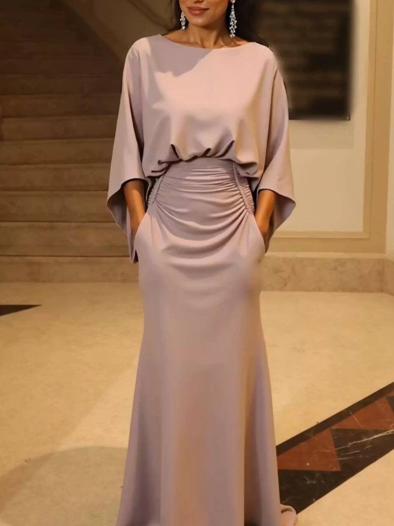 Batwing sleeve ruched evening dress by Trendsi featuring a fitted silhouette and elegant design, shown on a model.