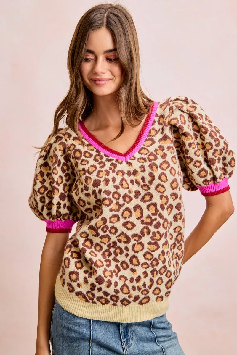 Leopard pattern puff sleeve V-neck sweater top by Trendsi, featuring a stylish design and cozy knit fabric.