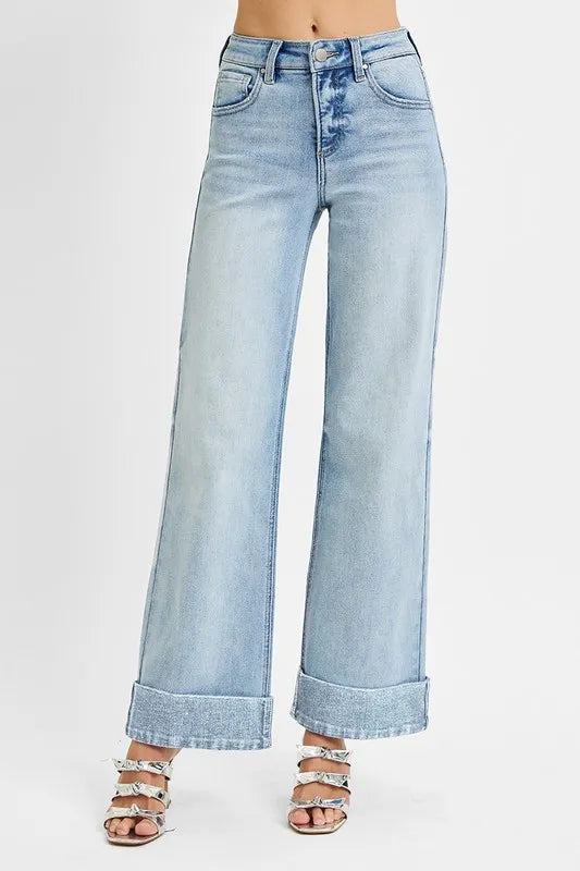 Wide cuffed high-rise ankle jeans in denim with a fitted waist and relaxed legs, styled by Trendsi.