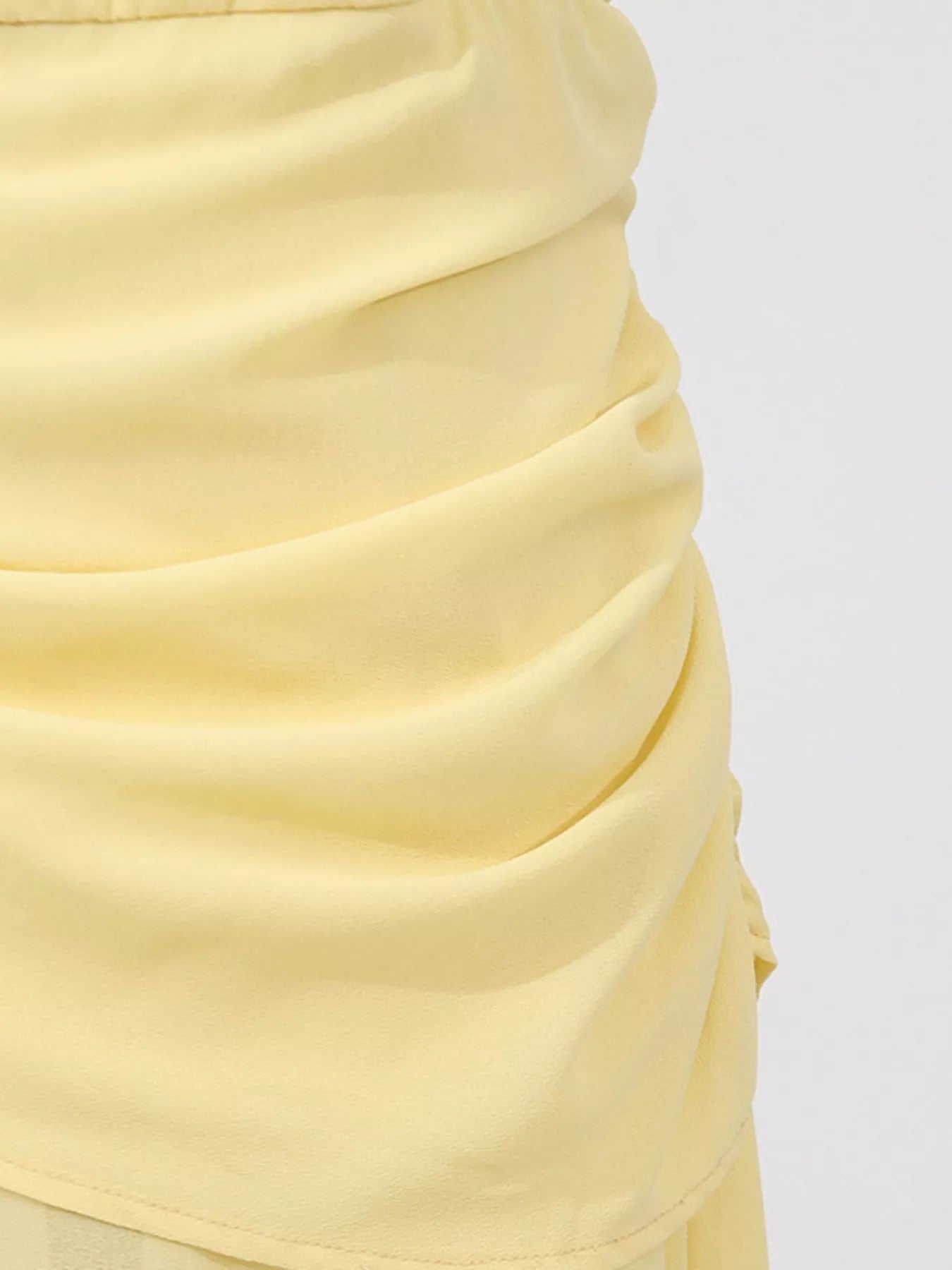 Yellow sleeveless ruched high-slit maxi dress from Trendsi featuring a flowing silhouette and elegant design.