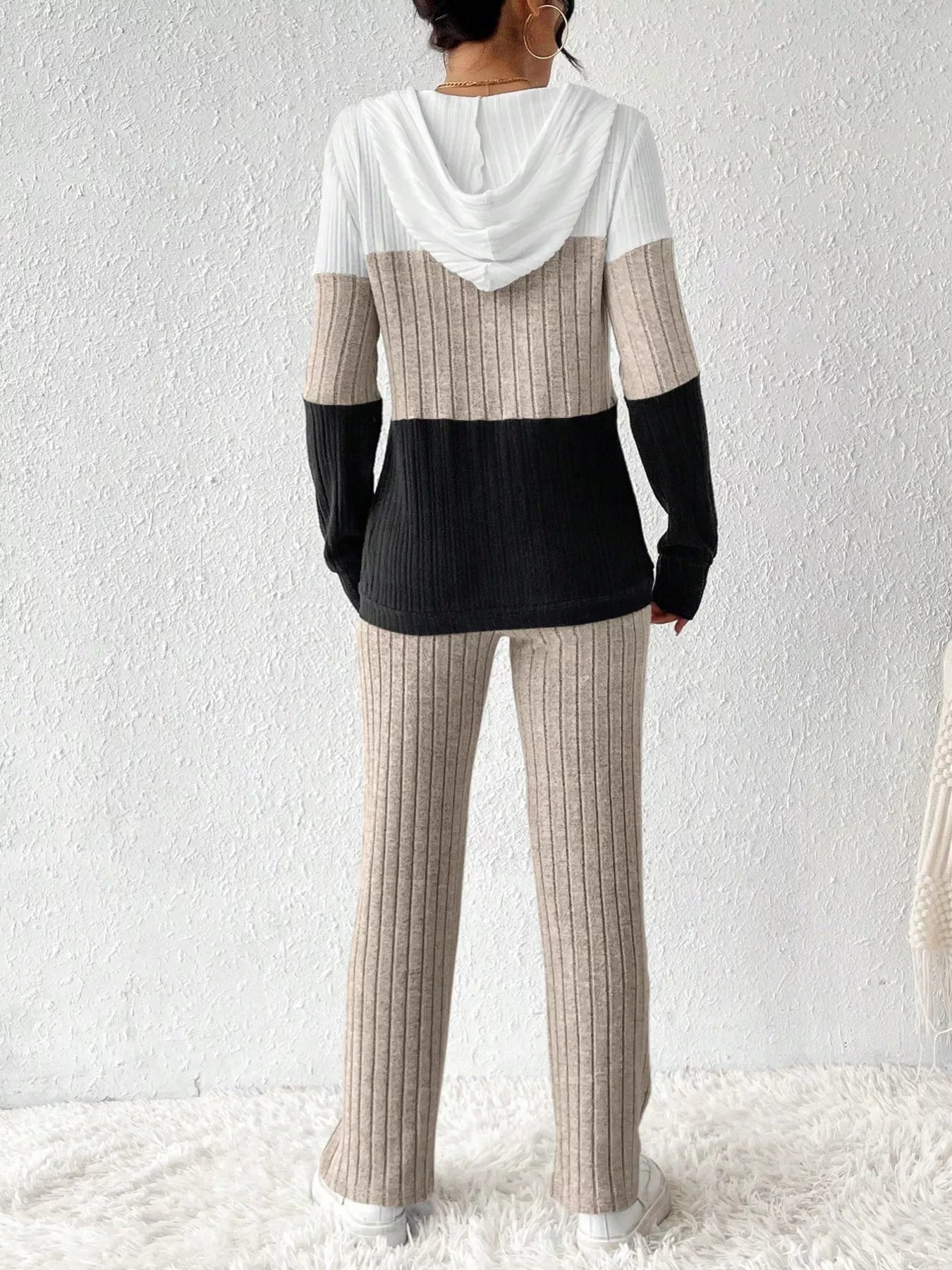 Color block half zip hooded top and matching pants set by Trendsi, featuring a stylish casual look with vibrant color panels.