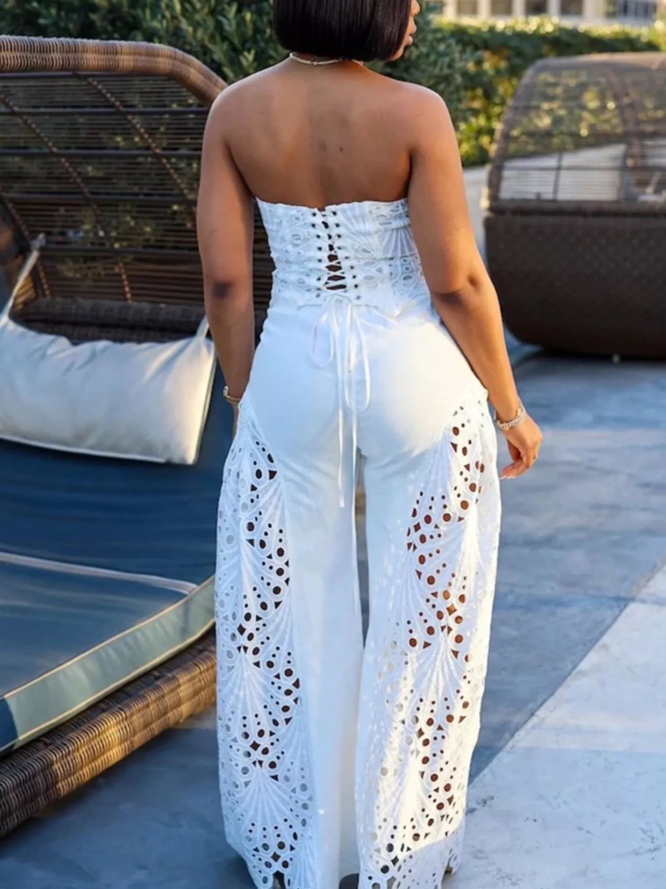 Trendsi matching set featuring a stylish cutout tube top and wide-leg pants in a trendy, coordinated outfit.