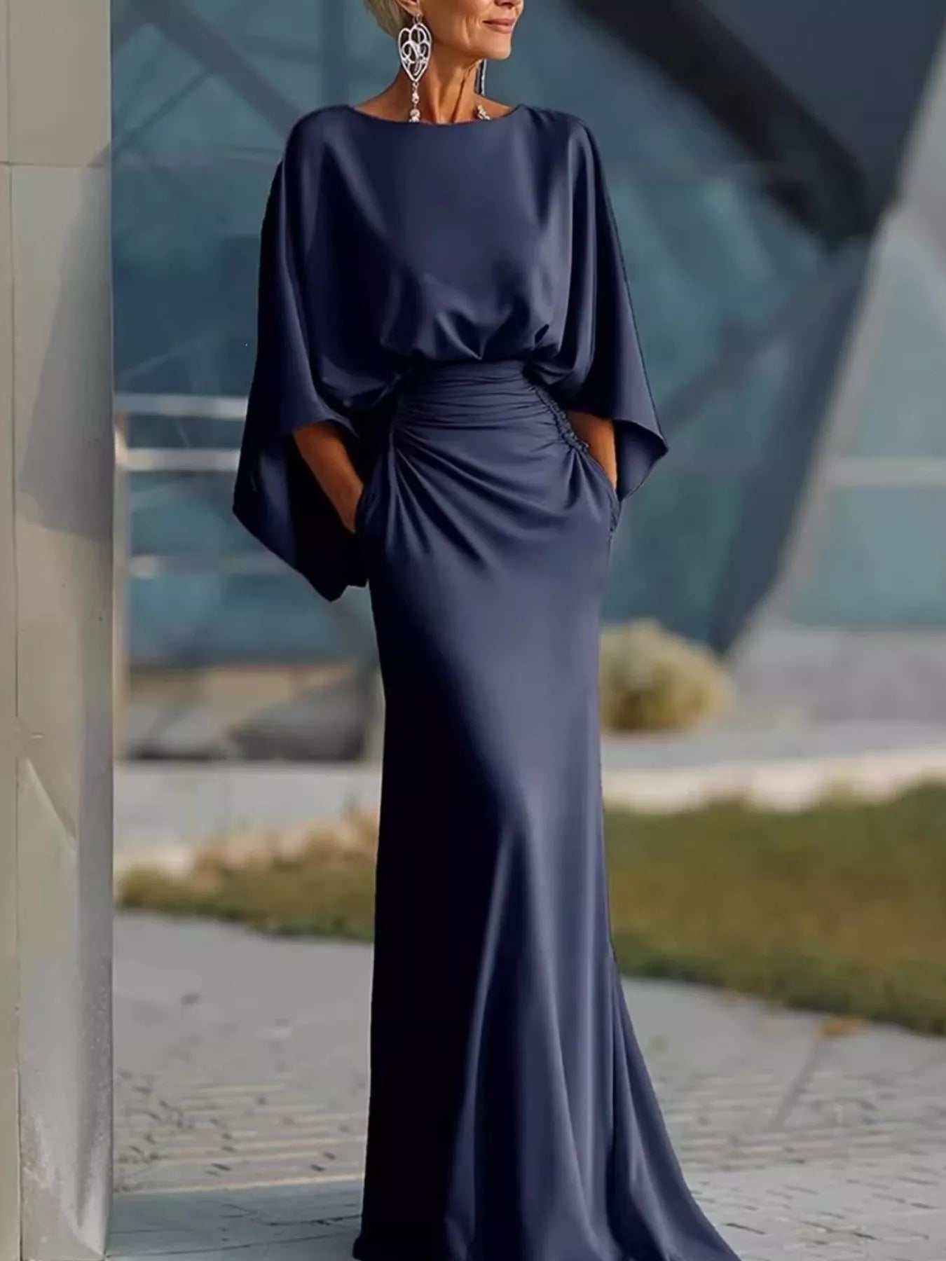 Batwing sleeve ruched evening dress by Trendsi, featuring a fitted silhouette and elegant design, shown on a model.